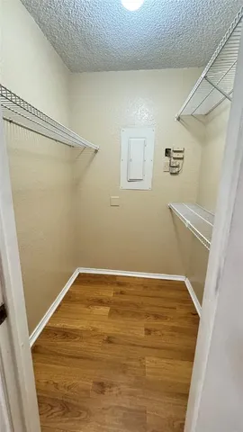 a view of a room with wooden floor and staircase