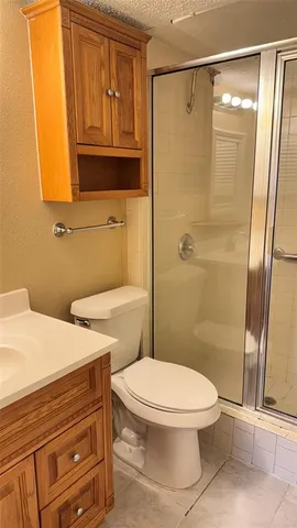 a bathroom with a sink a mirror and a toilet