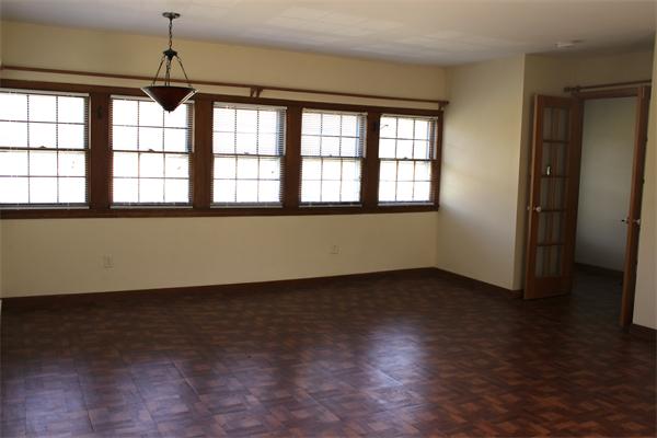 118 Washington Road Brimfield, MA 01010 - Photo 4 of 20 a view of an empty room with wooden floor and a window