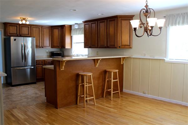 118 Washington Road Brimfield, MA 01010 - Photo 7 of 20 a kitchen with stainless steel appliances granite countertop a refrigerator a sink dishwasher a dining table and chairs with wooden floor