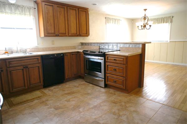 118 Washington Road Brimfield, MA 01010 - Photo 10 of 20 a kitchen with stainless steel appliances granite countertop a stove a sink and a microwave