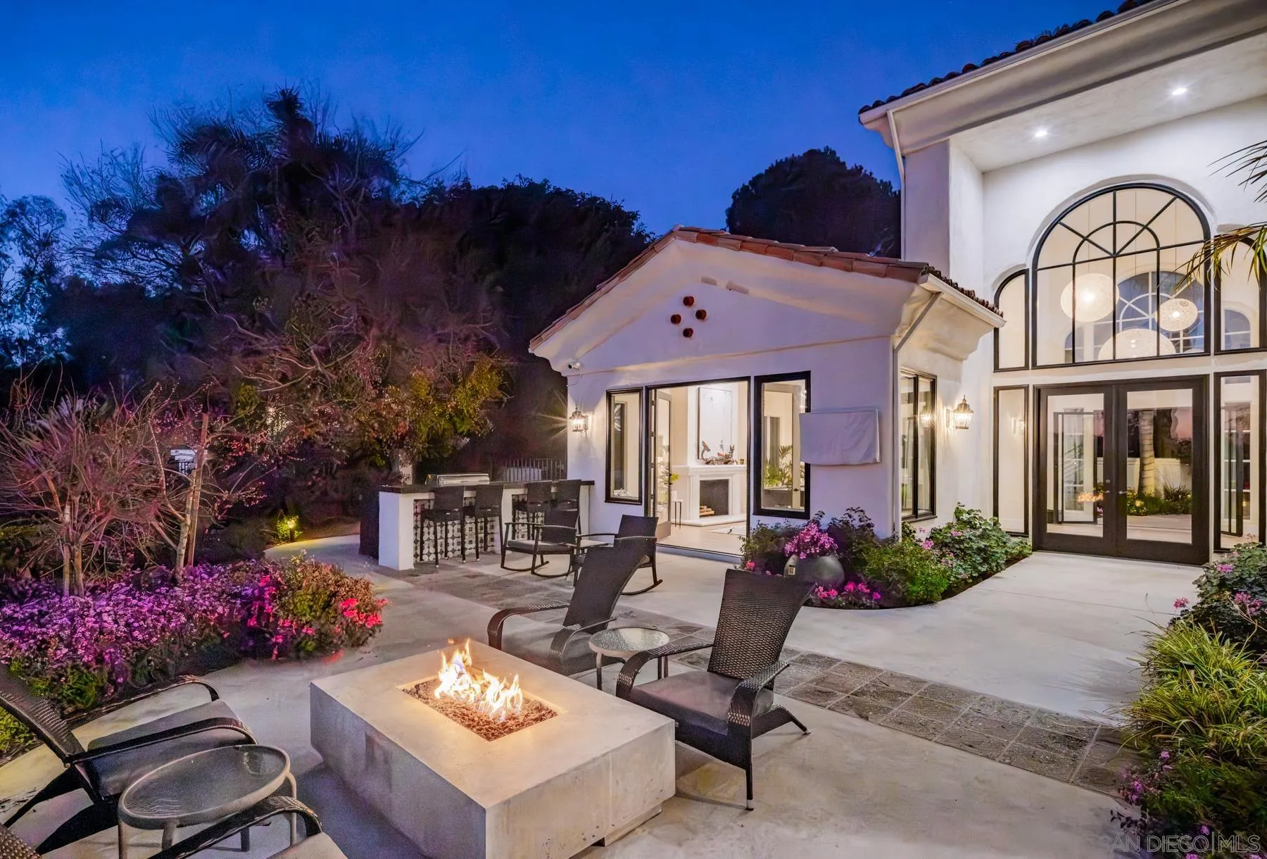 7430 St Andrews Road Rancho Santa Fe, CA 92067 - Photo 39 of 48 a front view of a house with a garden and patio
