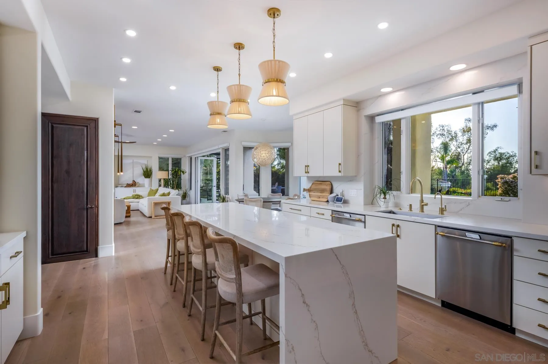 7430 St Andrews Road Rancho Santa Fe, CA 92067 - Photo 8 of 48 a kitchen with center island and stainless steel appliances