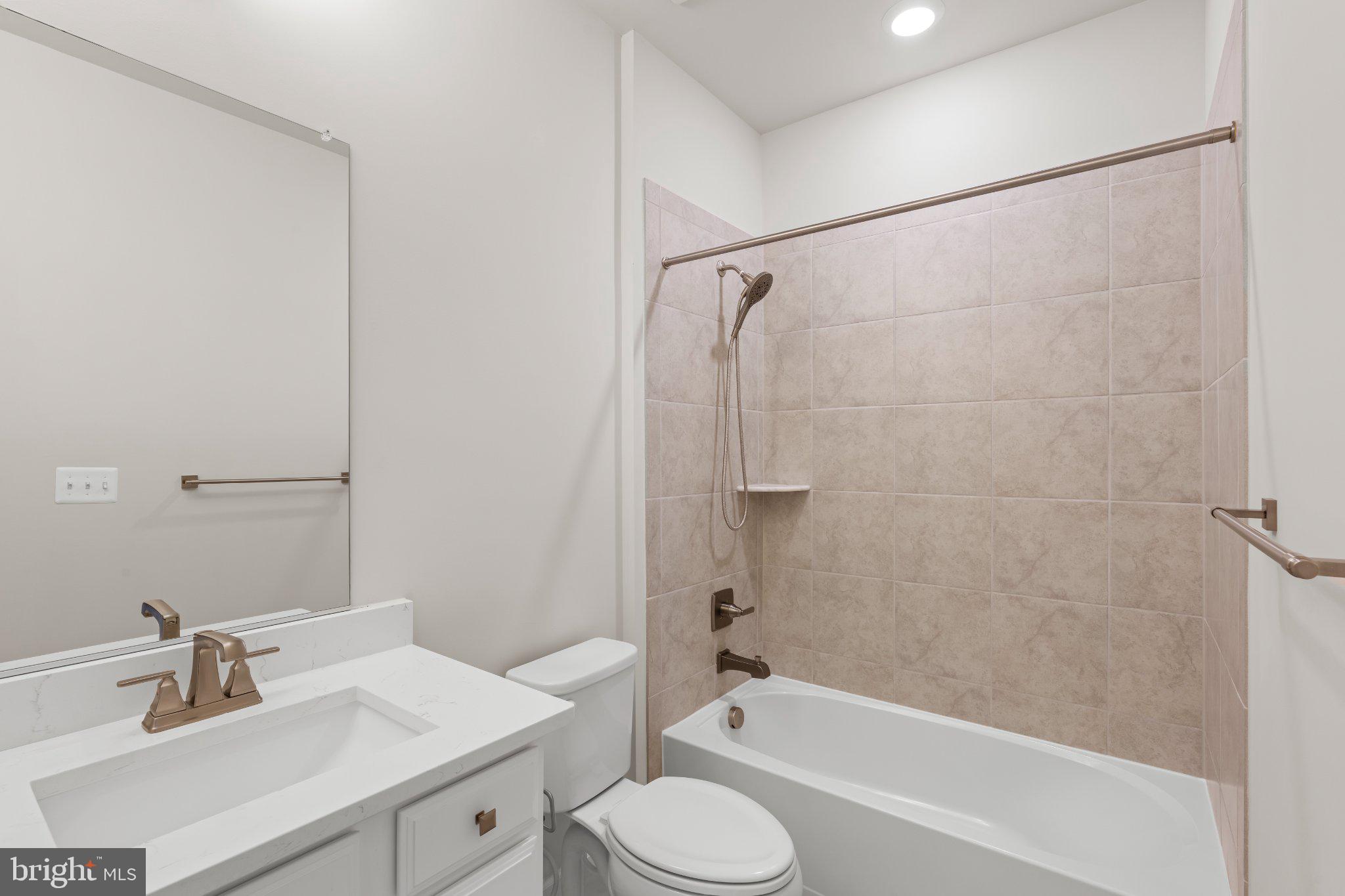 7504 Overview Terrace Columbia, MD 21044 - Photo 22 of 54 a bathroom with a sink toilet and shower