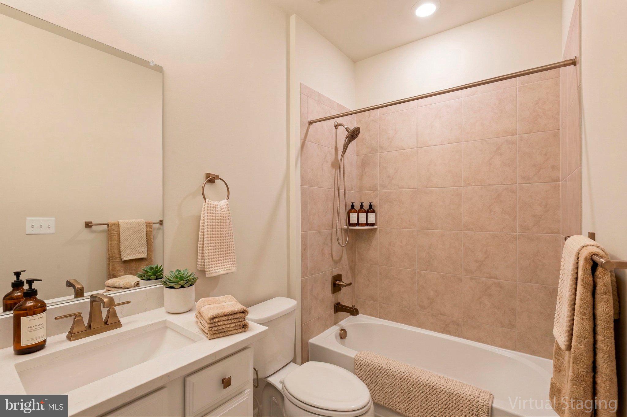 7504 Overview Terrace Columbia, MD 21044 - Photo 23 of 54 a bathroom with a granite countertop sink toilet and shower