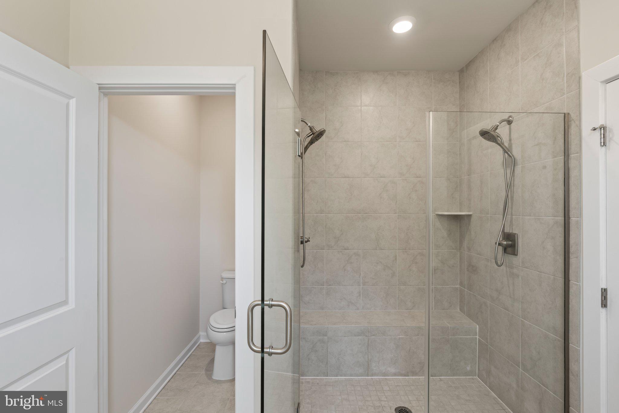 7504 Overview Terrace Columbia, MD 21044 - Photo 28 of 54 a bathroom with a glass shower door