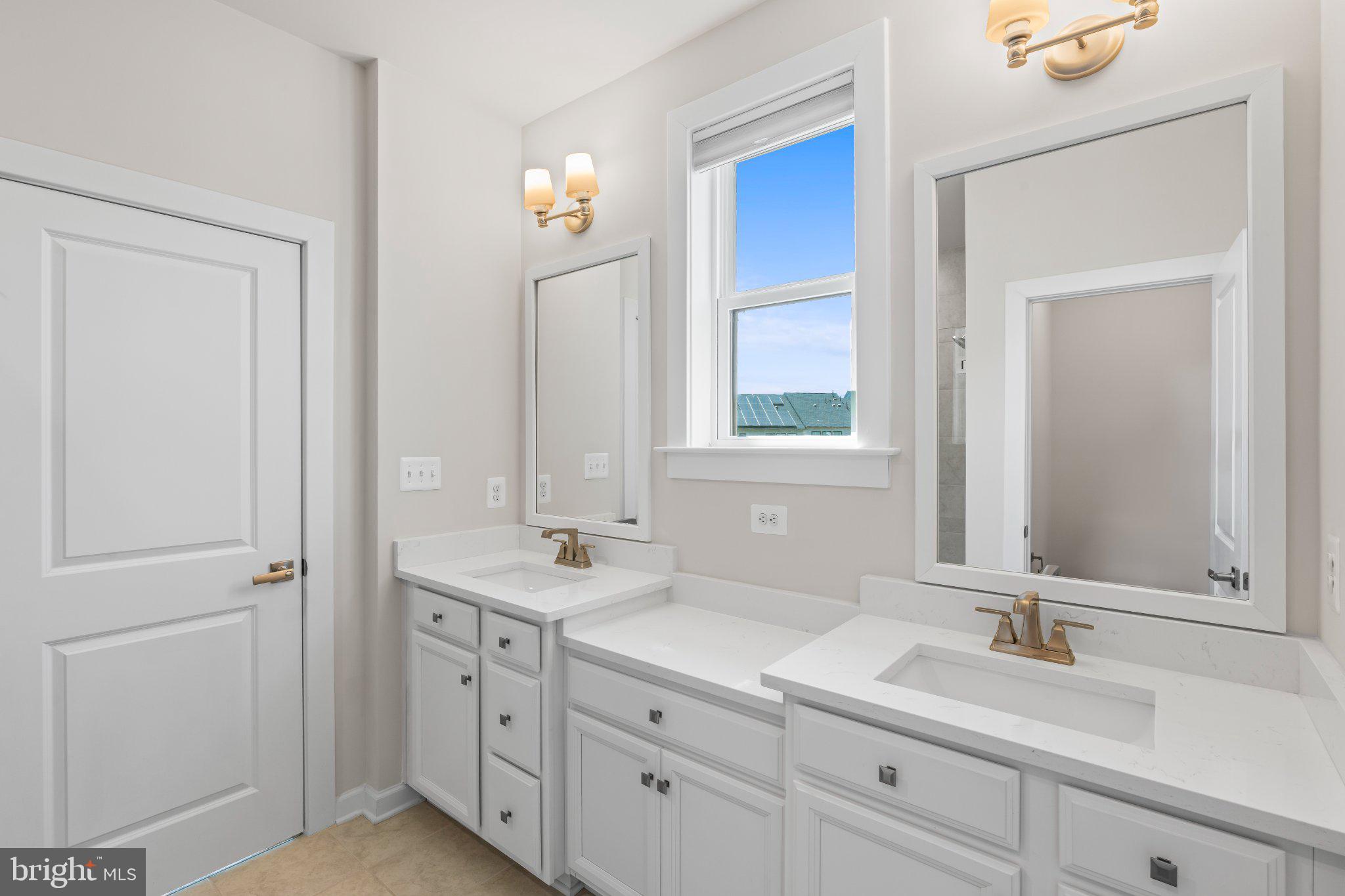 7504 Overview Terrace Columbia, MD 21044 - Photo 29 of 54 a bathroom with a sink and a mirror