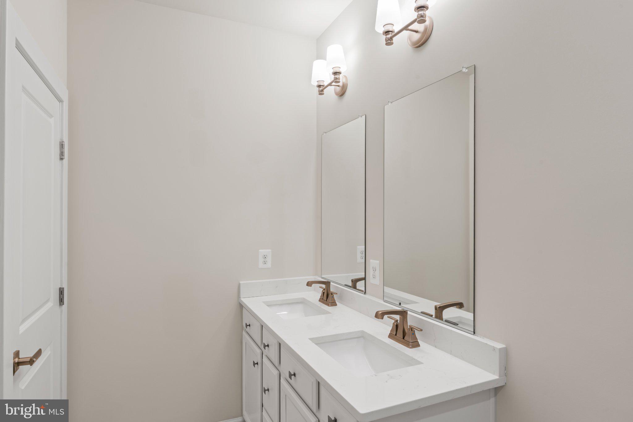 7504 Overview Terrace Columbia, MD 21044 - Photo 40 of 54 Sleek dual vanity in modern bathroom.
