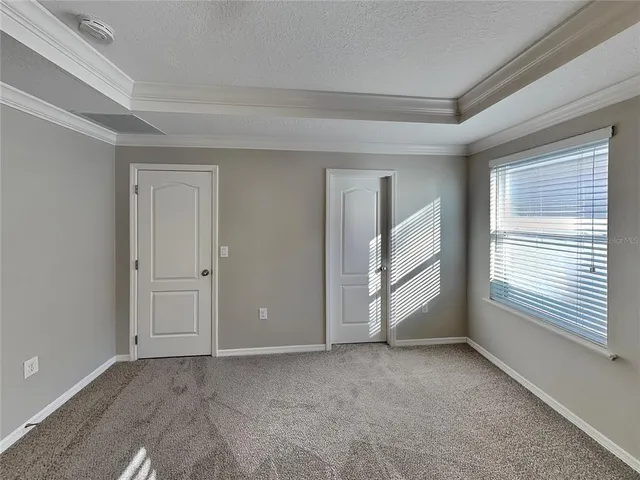 a view of an empty room and a window