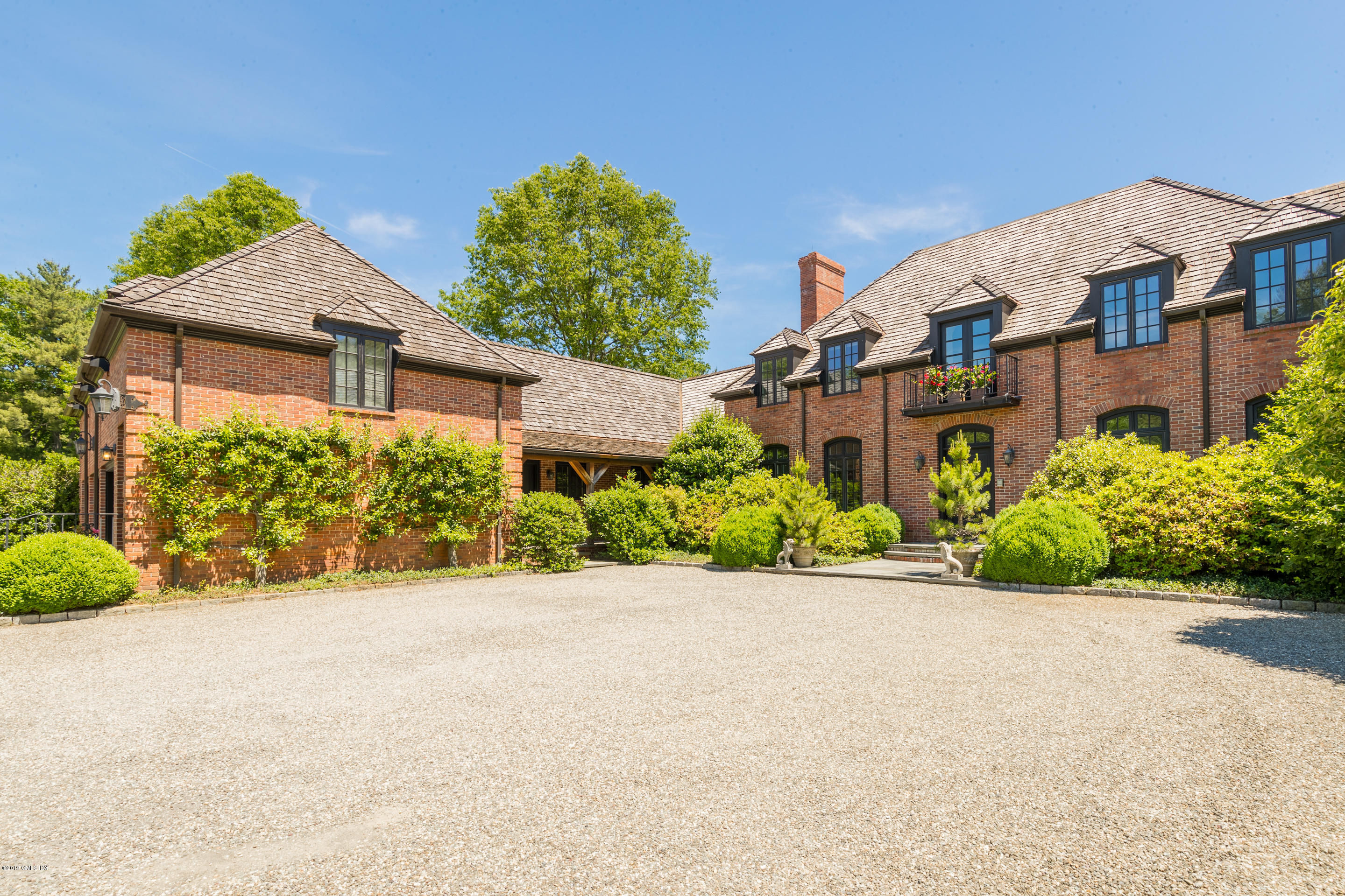 55 Mooreland Road Greenwich, CT 06831 - Photo 13 of 43 front view of a house with a yard