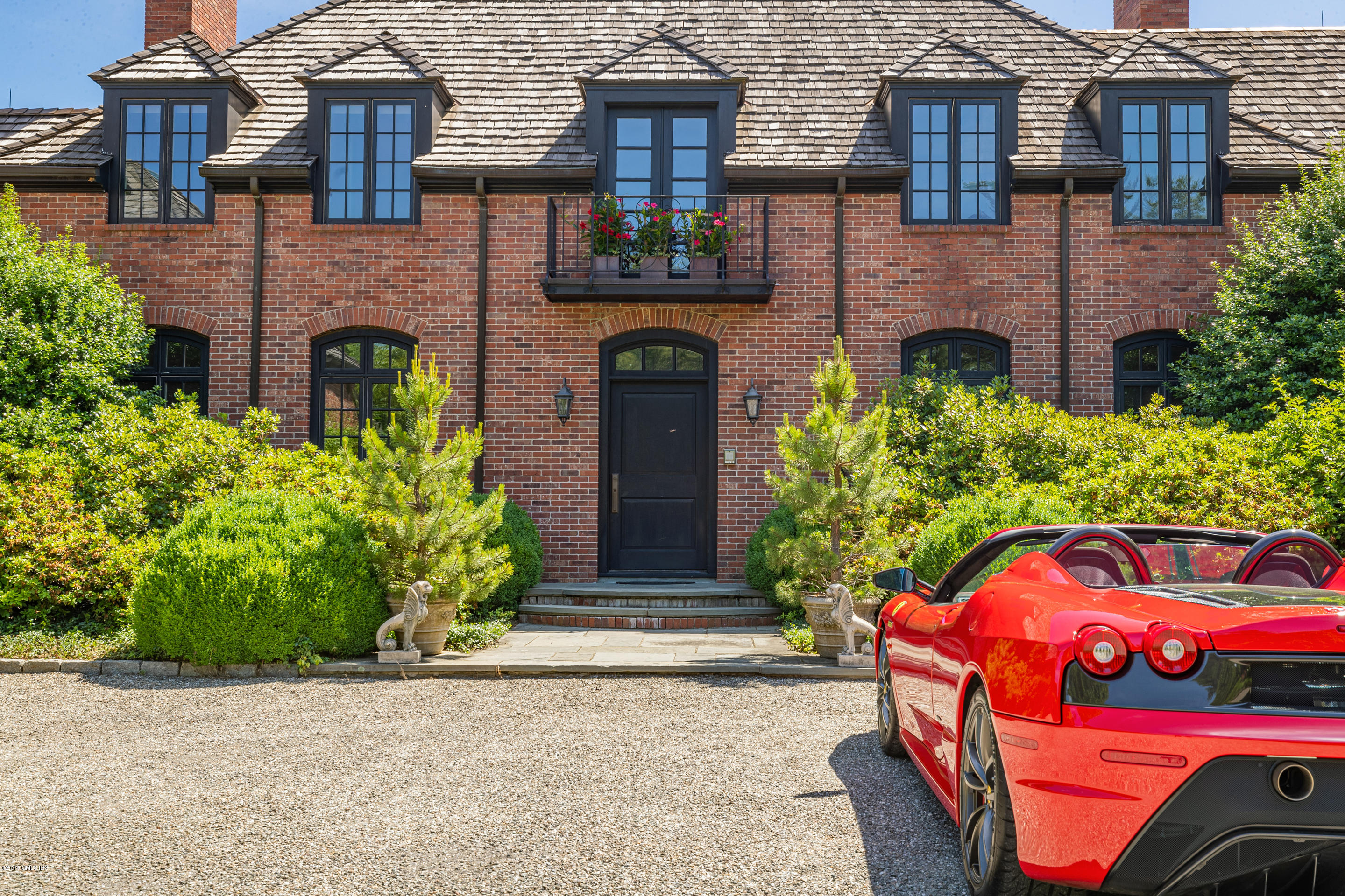55 Mooreland Road Greenwich, CT 06831 - Photo 15 of 43 a front view of a house with garden