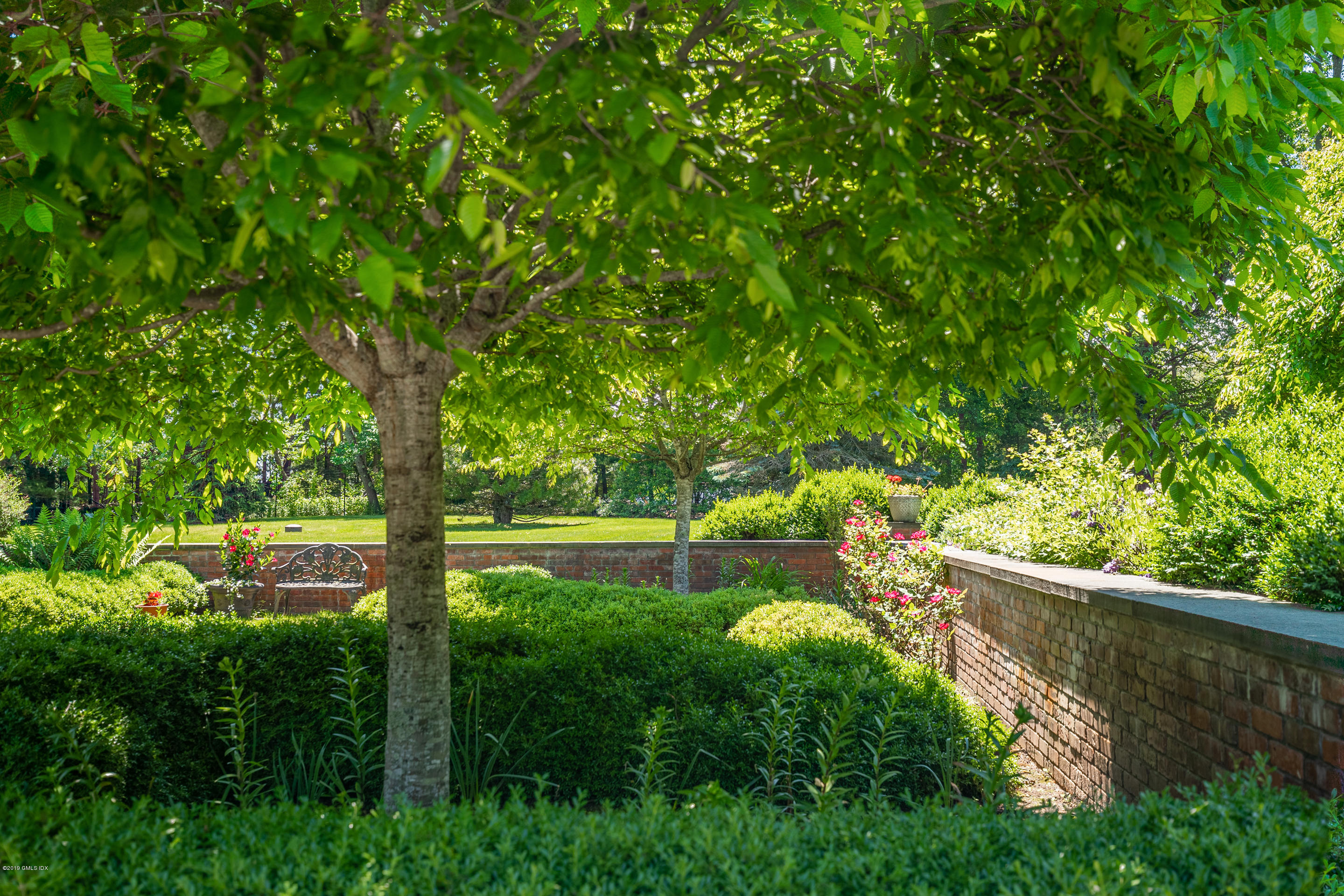 55 Mooreland Road Greenwich, CT 06831 - Photo 16 of 43 a yard with large trees