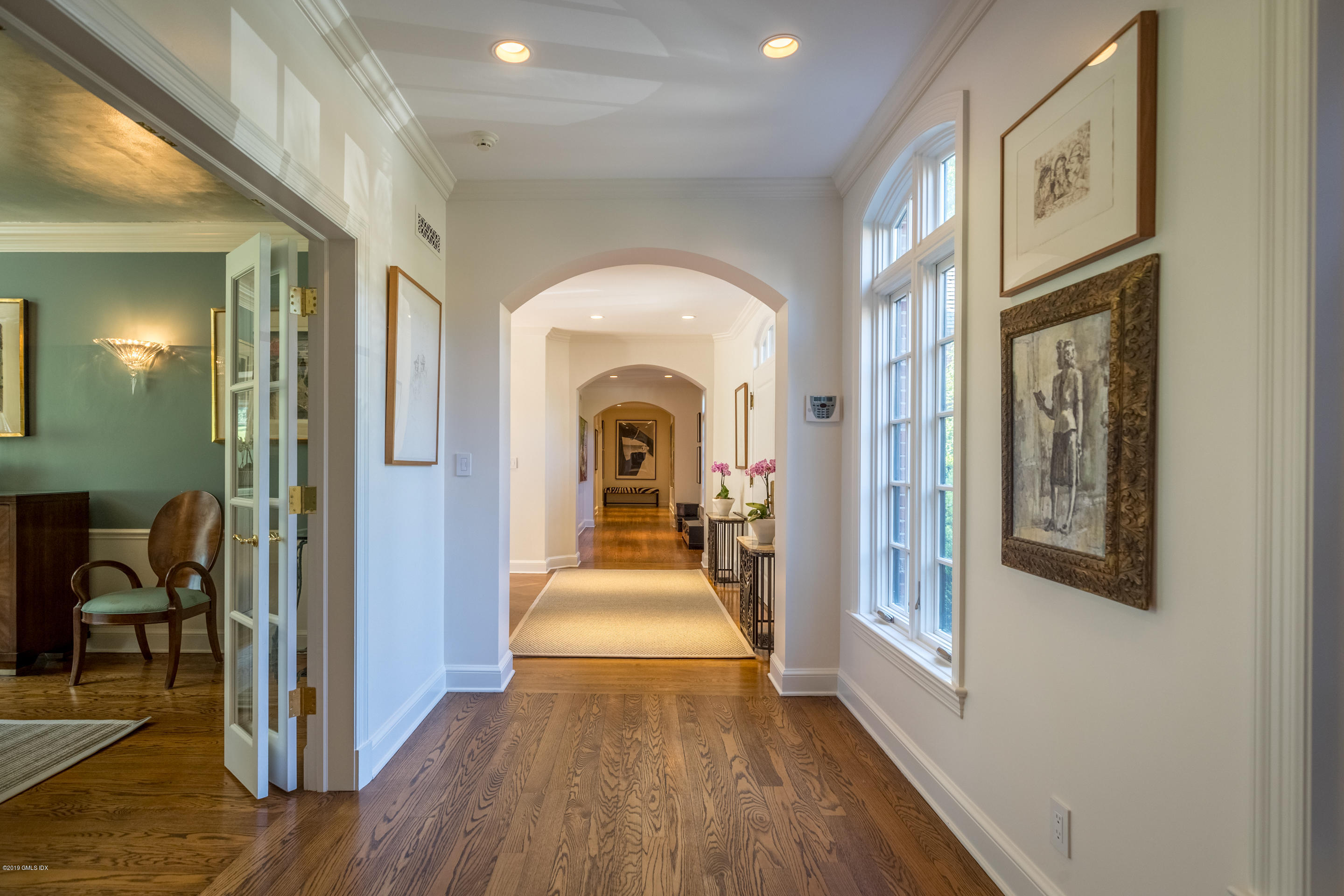 55 Mooreland Road Greenwich, CT 06831 - Photo 20 of 43 a view of a hallway with wooden floor and furniture