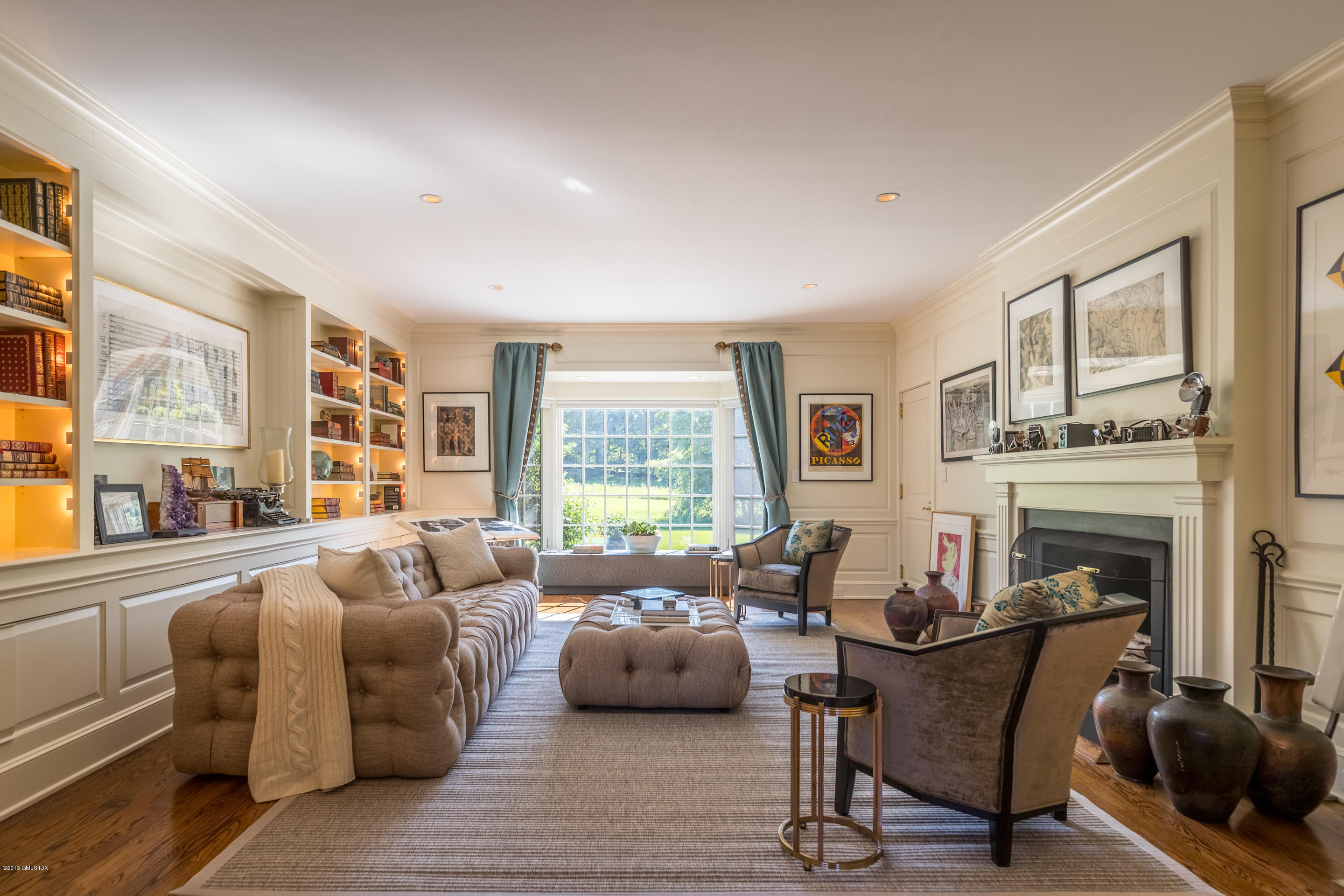 55 Mooreland Road Greenwich, CT 06831 - Photo 21 of 43 a living room with furniture large window and wooden floor