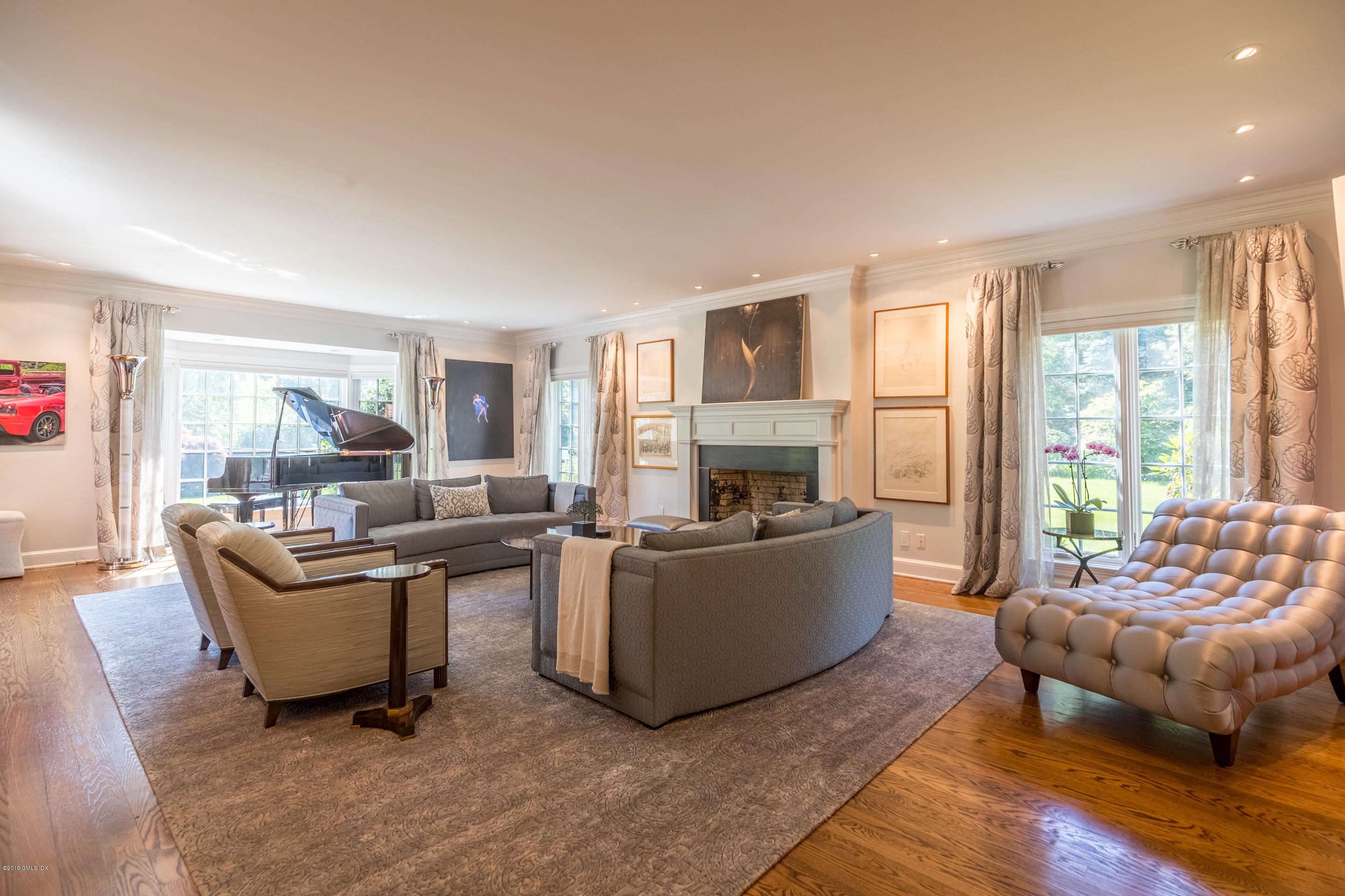 55 Mooreland Road Greenwich, CT 06831 - Photo 25 of 43 a living room with furniture and a fireplace
