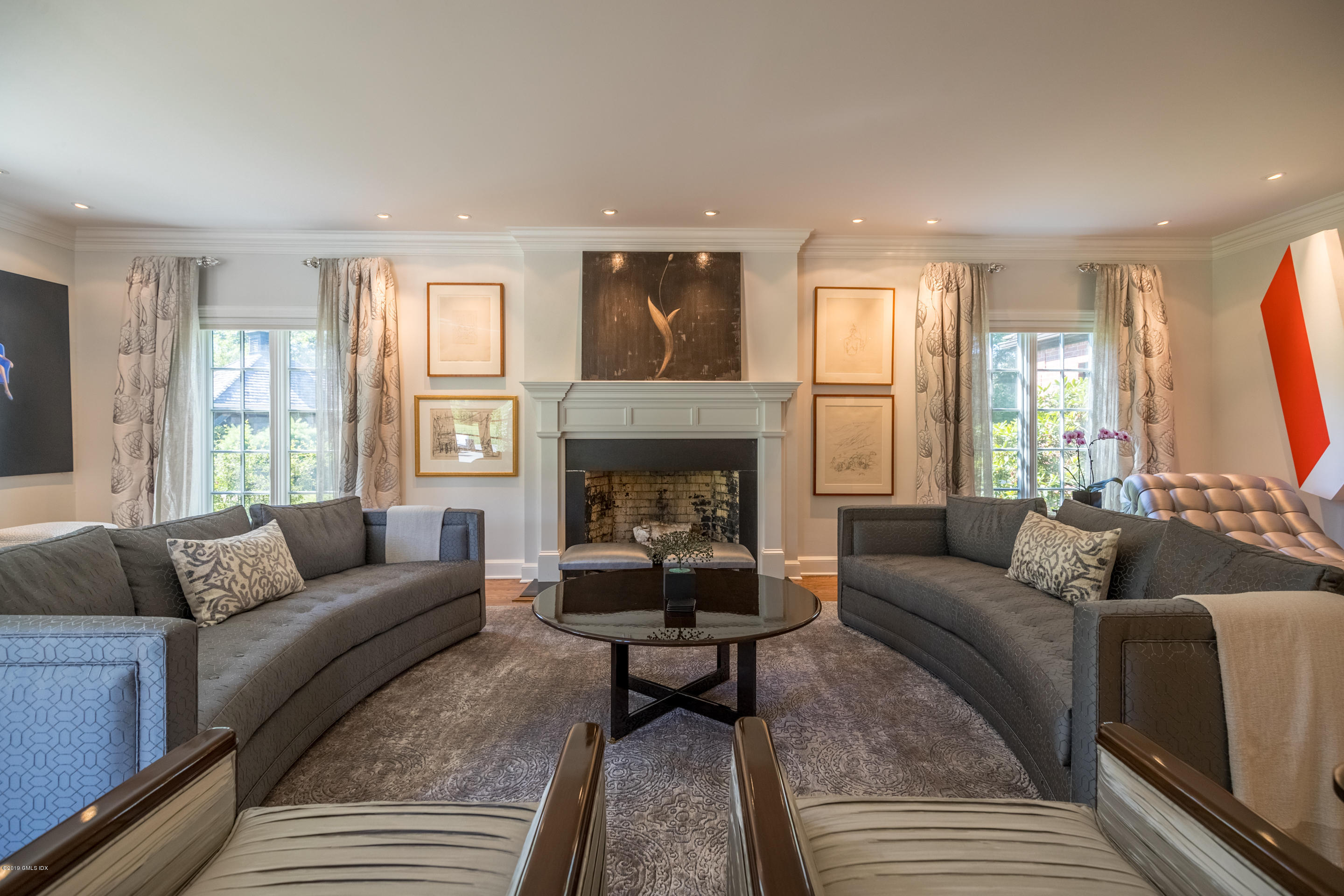 55 Mooreland Road Greenwich, CT 06831 - Photo 26 of 43 a living room with furniture and a fireplace