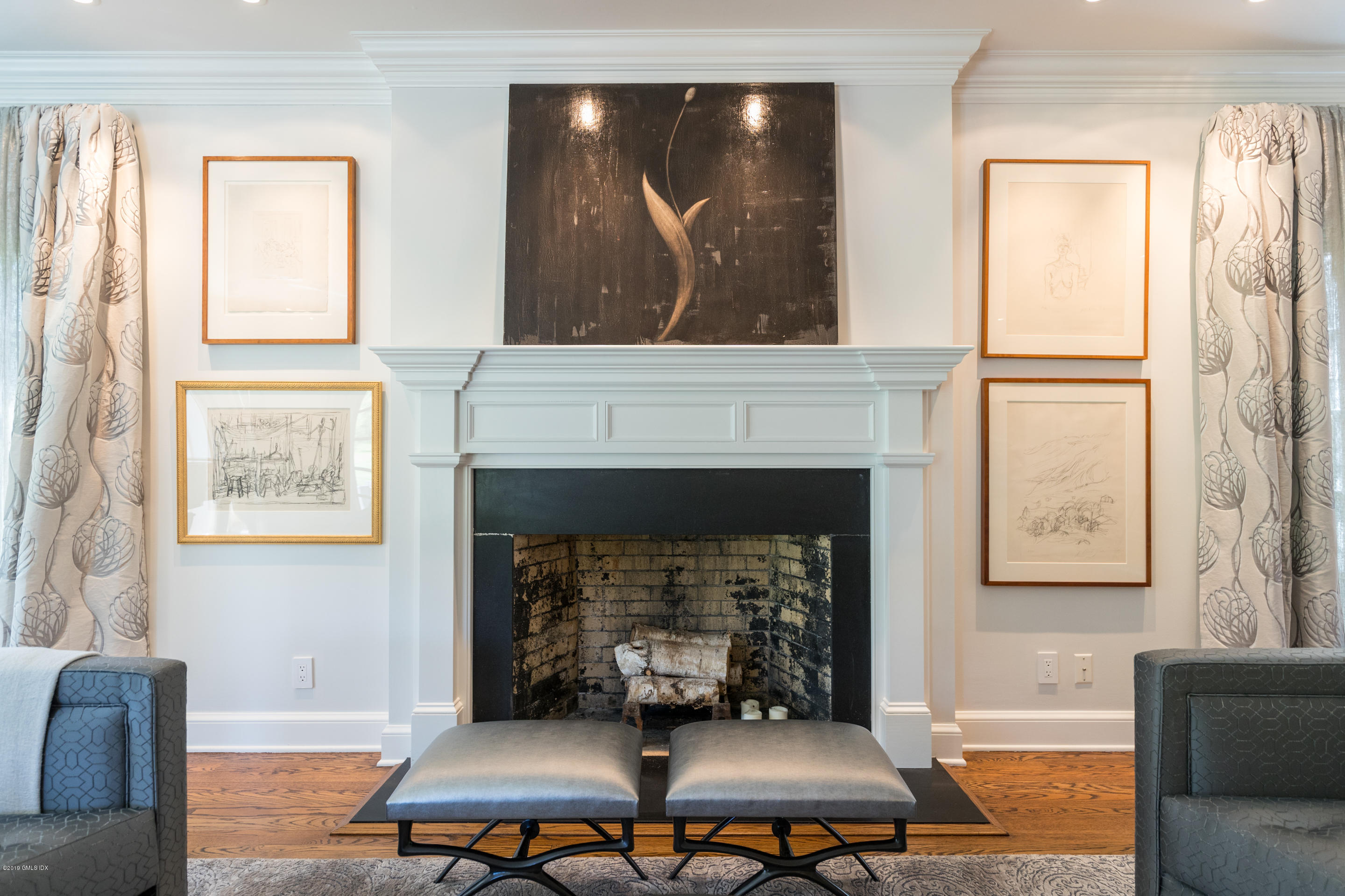55 Mooreland Road Greenwich, CT 06831 - Photo 27 of 43 a living room with furniture and a fireplace