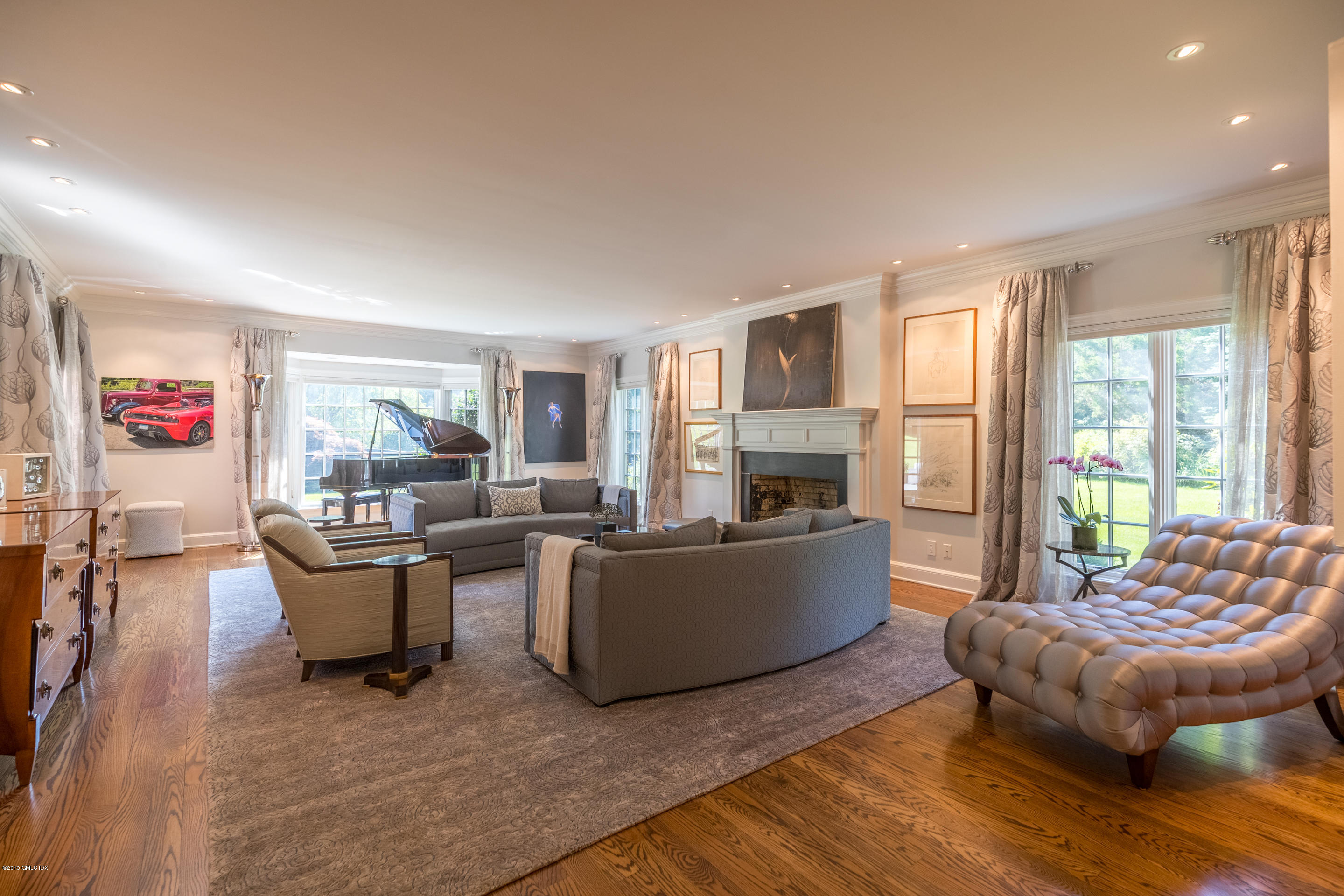 55 Mooreland Road Greenwich, CT 06831 - Photo 28 of 43 a living room with furniture and a fireplace