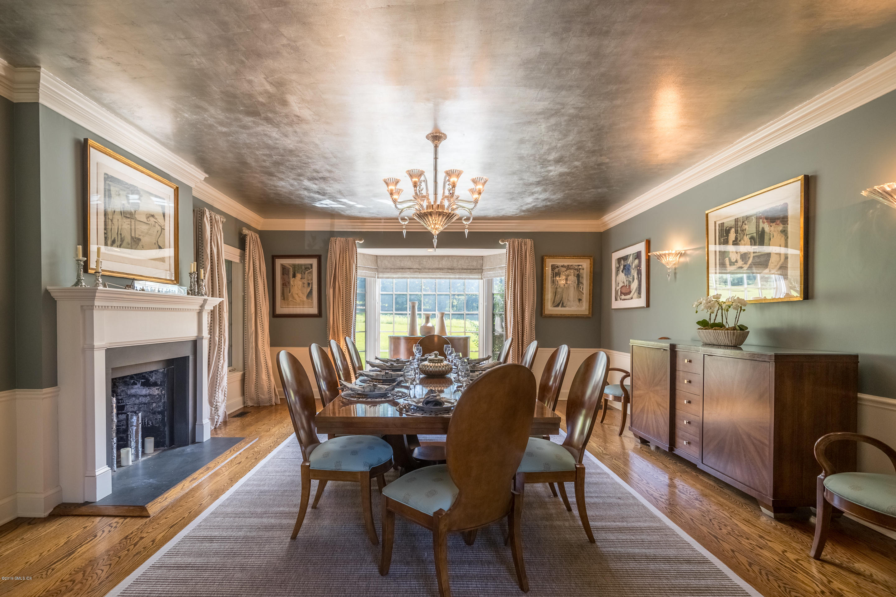 55 Mooreland Road Greenwich, CT 06831 - Photo 31 of 43 a view of a dining room with furniture window and wooden floor