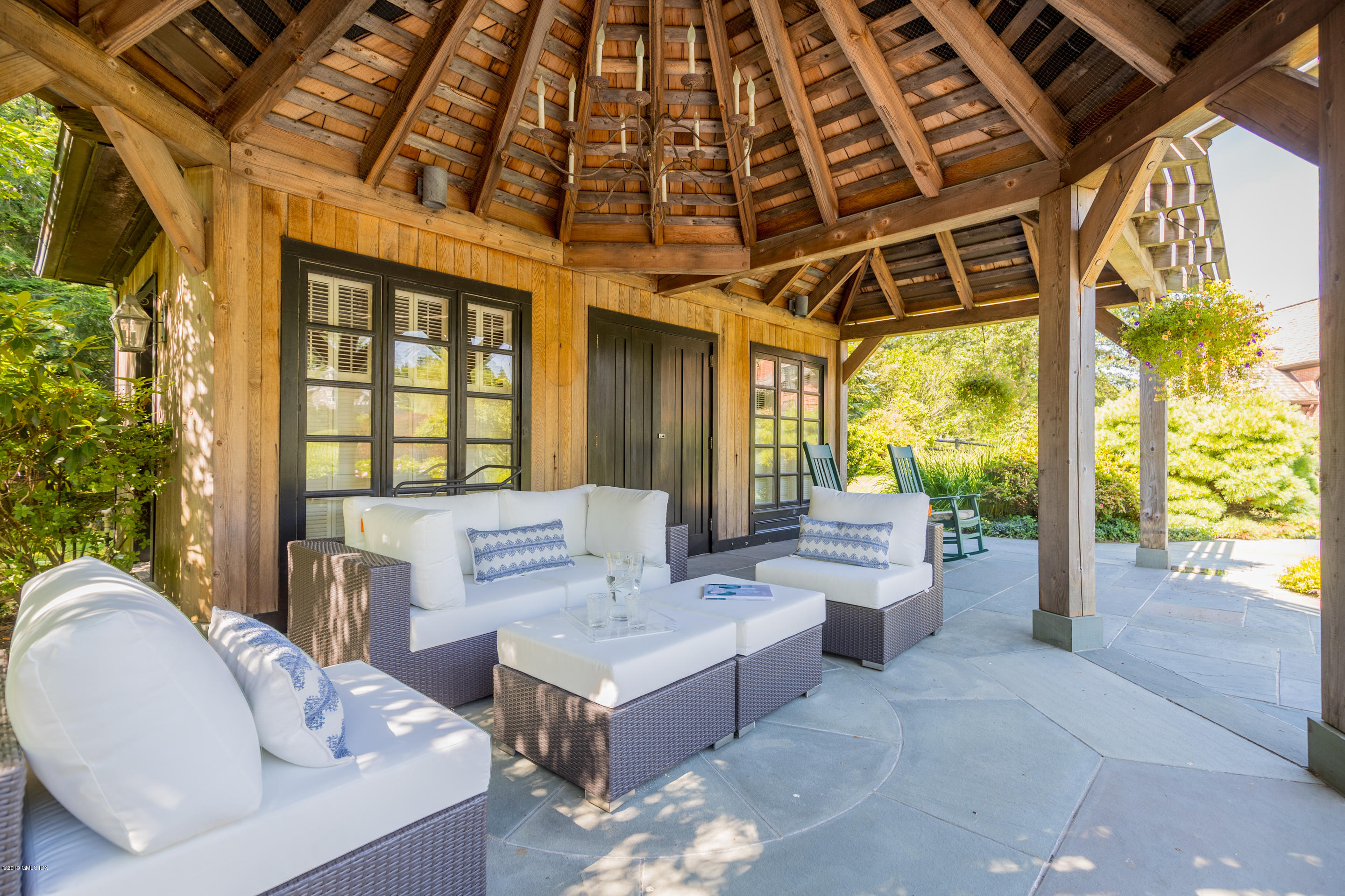 55 Mooreland Road Greenwich, CT 06831 - Photo 34 of 43 a living room with furniture and a floor to ceiling window