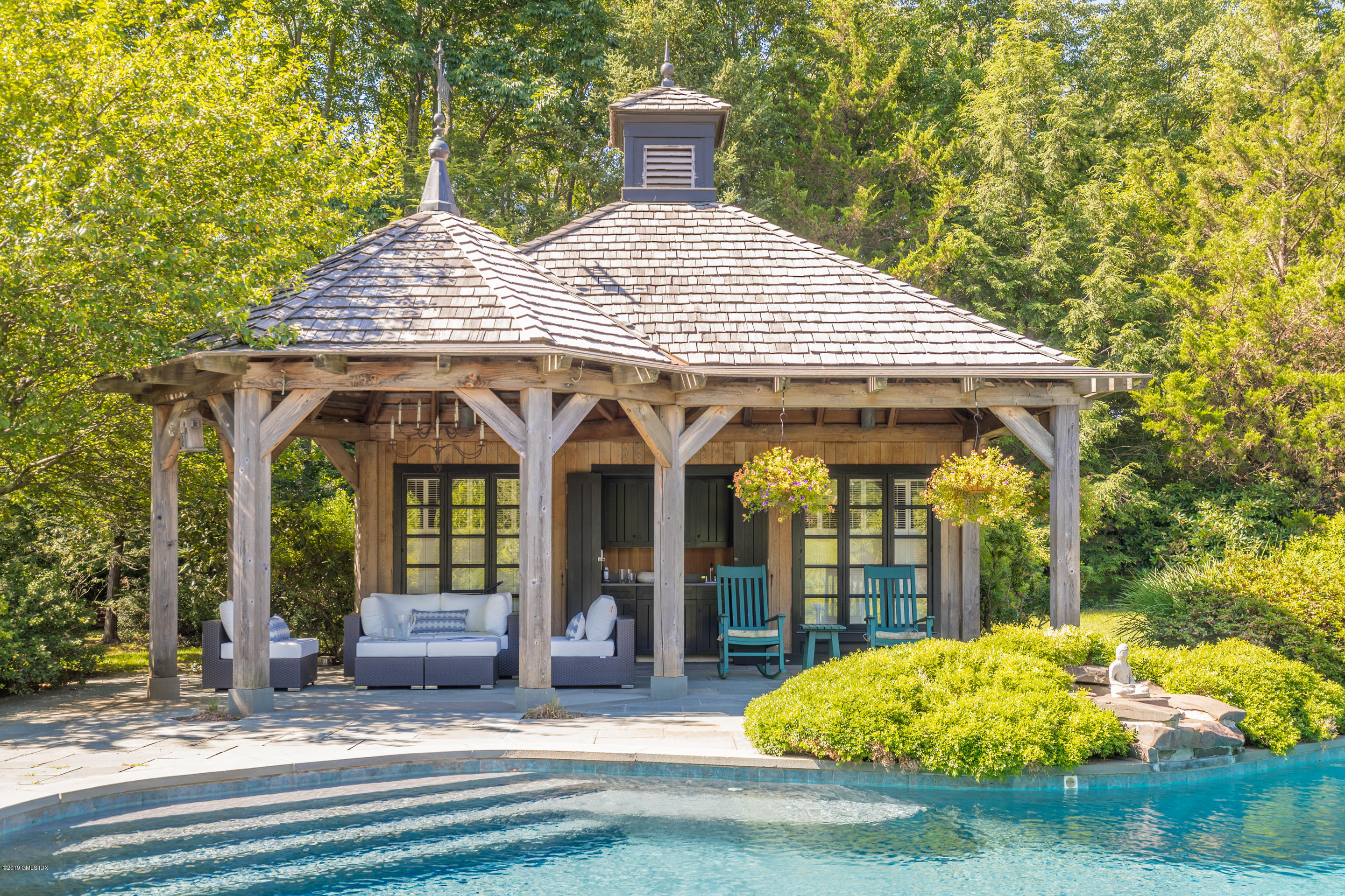 55 Mooreland Road Greenwich, CT 06831 - Photo 37 of 43 a front view of a house with garden