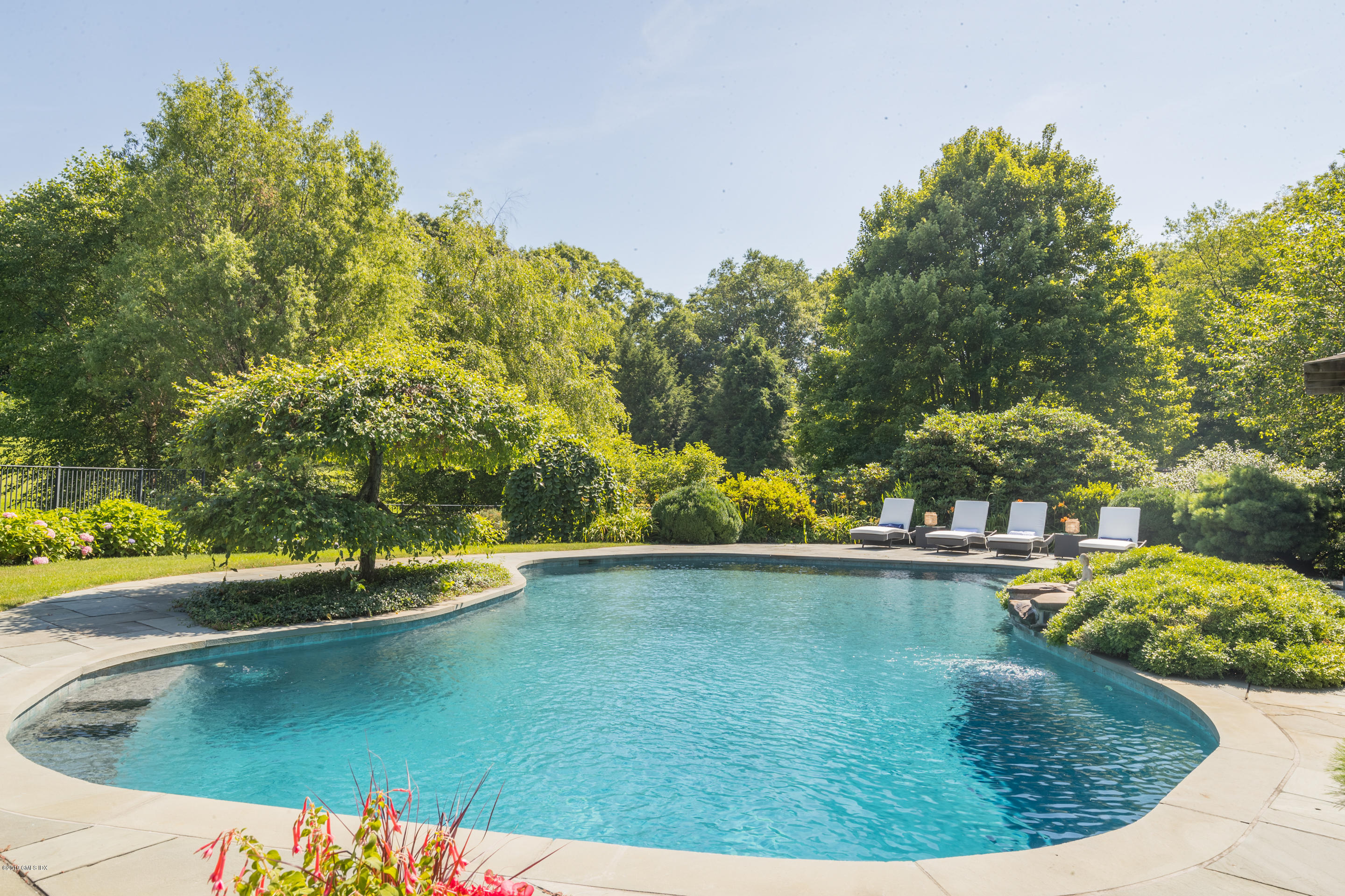 55 Mooreland Road Greenwich, CT 06831 - Photo 39 of 43 a view of a swimming pool with an outdoor space
