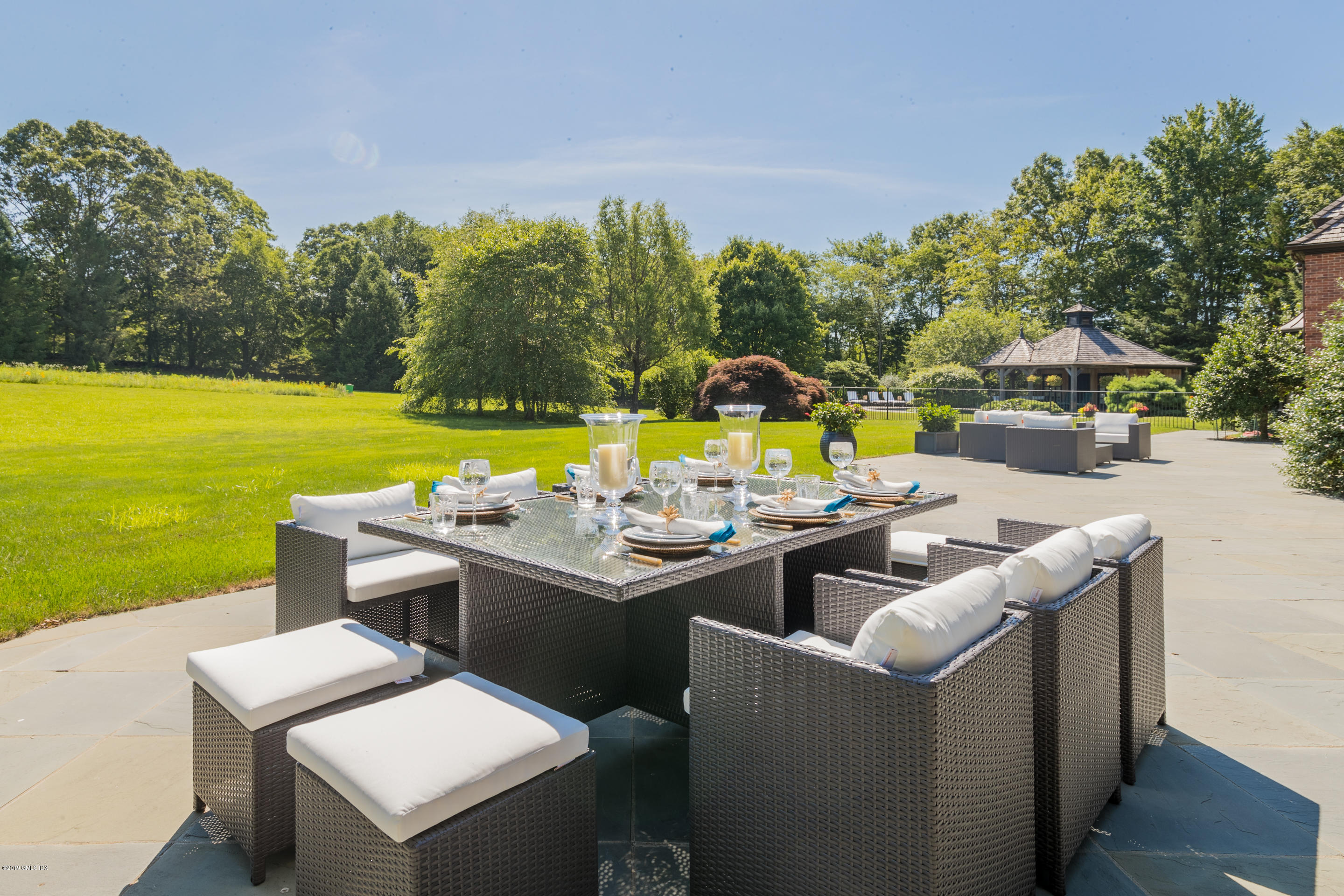 55 Mooreland Road Greenwich, CT 06831 - Photo 40 of 43 a view of a house with pool and a yard