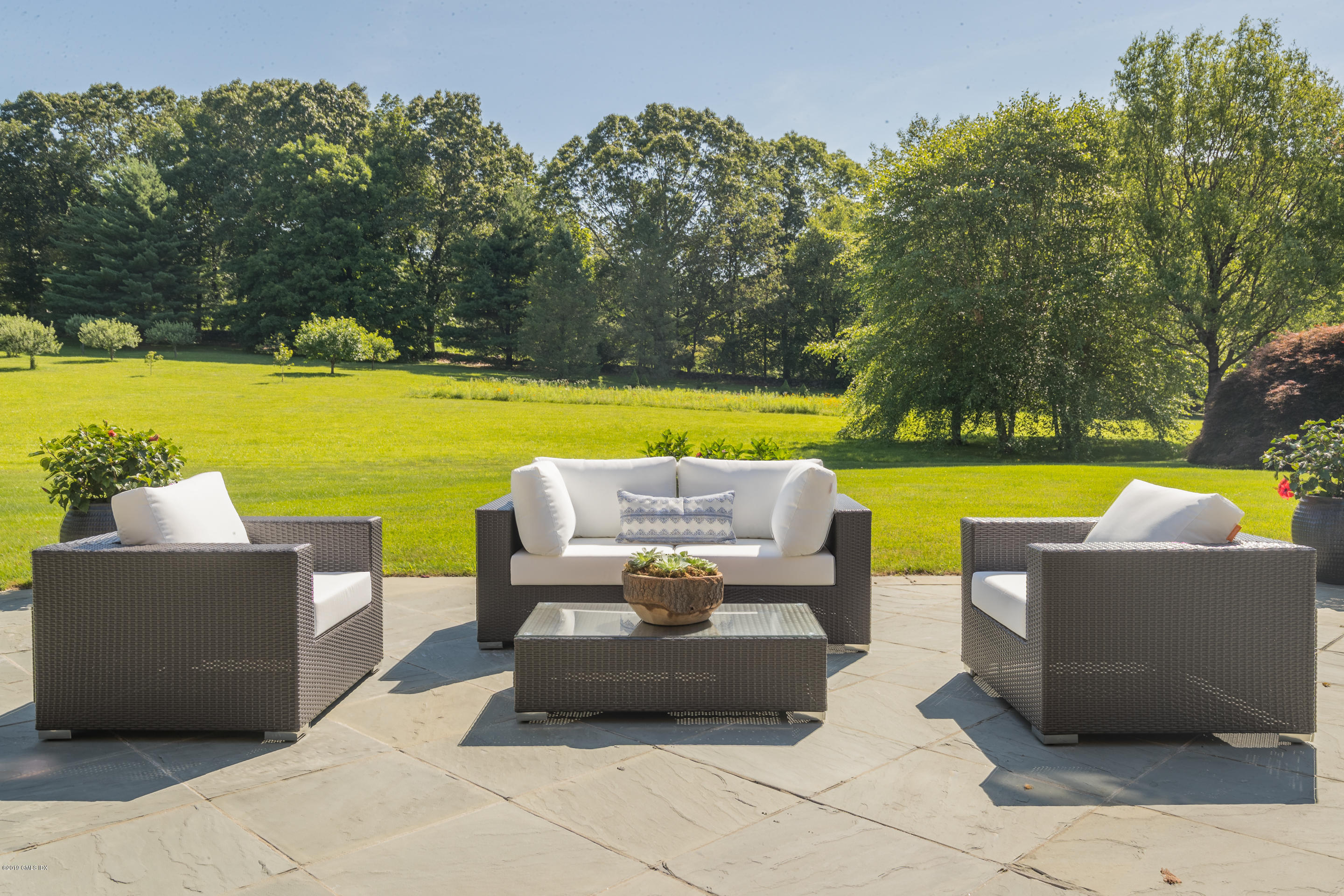 55 Mooreland Road Greenwich, CT 06831 - Photo 6 of 43 a view of a swimming pool and lounge chairs