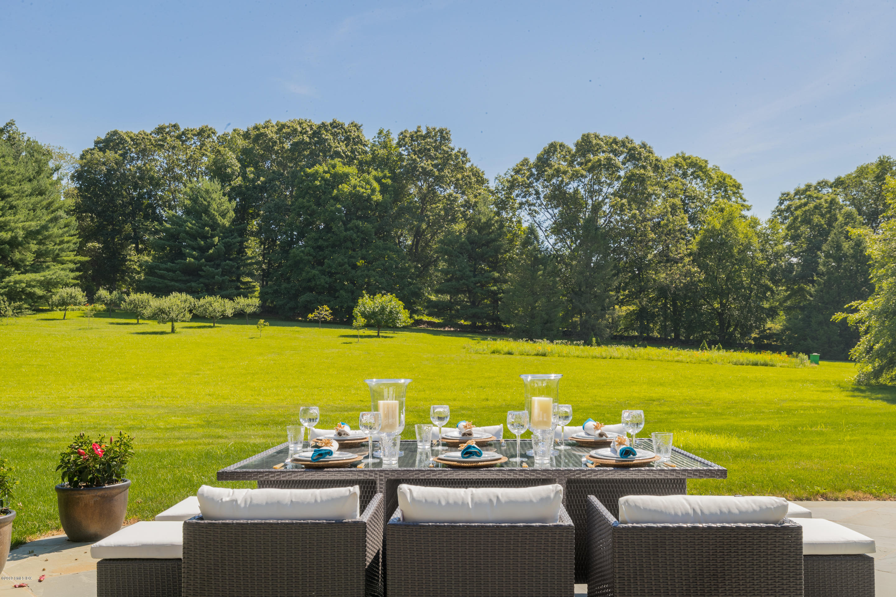55 Mooreland Road Greenwich, CT 06831 - Photo 9 of 43 a view of a swimming pool and an ocean view