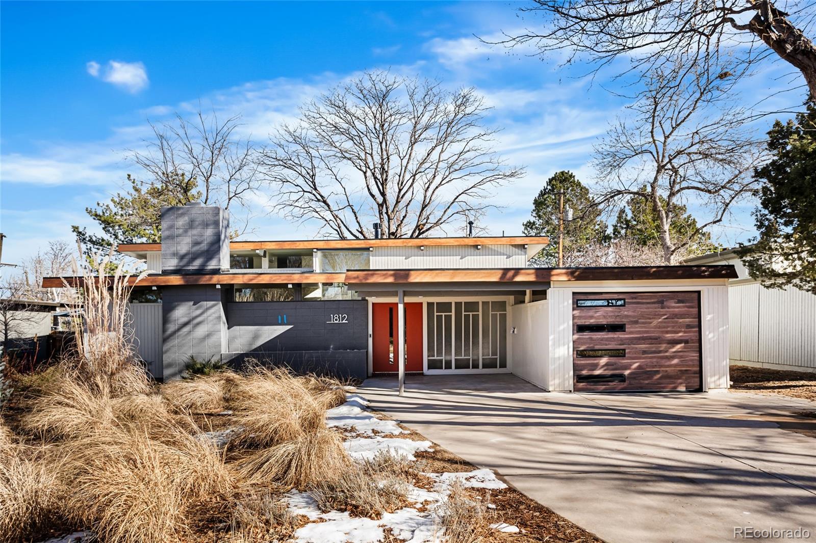 1812 South Ivanhoe Street Denver, CO 80224 - Photo 1 of 46 a view of a building with a snow