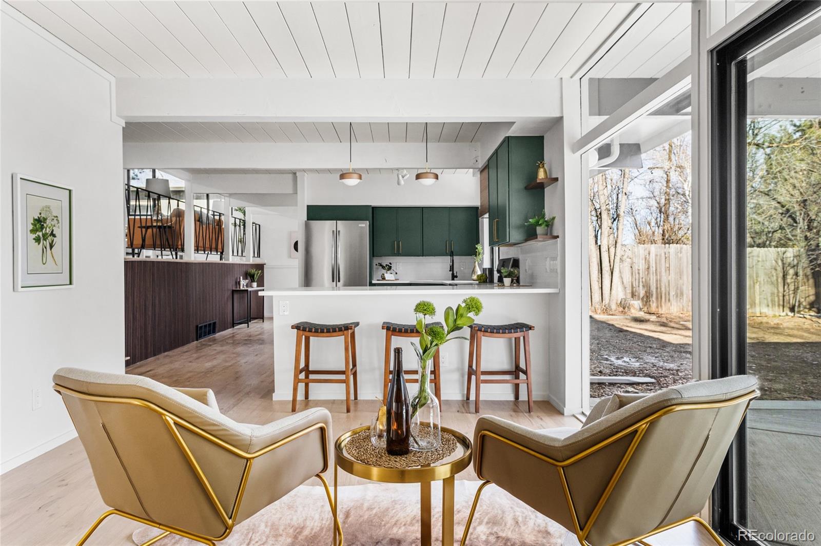 1812 South Ivanhoe Street Denver, CO 80224 - Photo 15 of 46 a living room with furniture and a large window