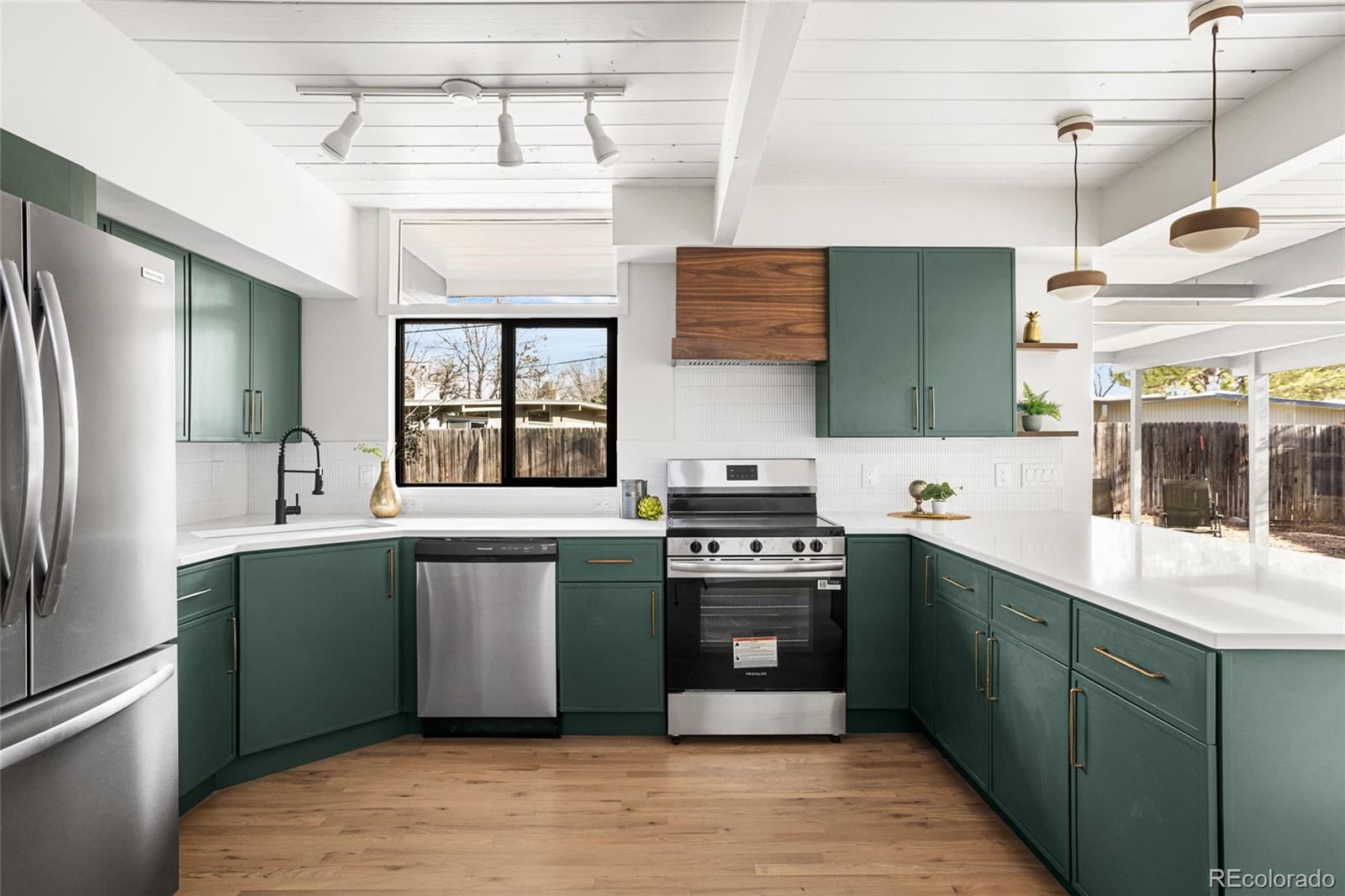 1812 South Ivanhoe Street Denver, CO 80224 - Photo 18 of 46 a kitchen with stainless steel appliances granite countertop a sink and stove