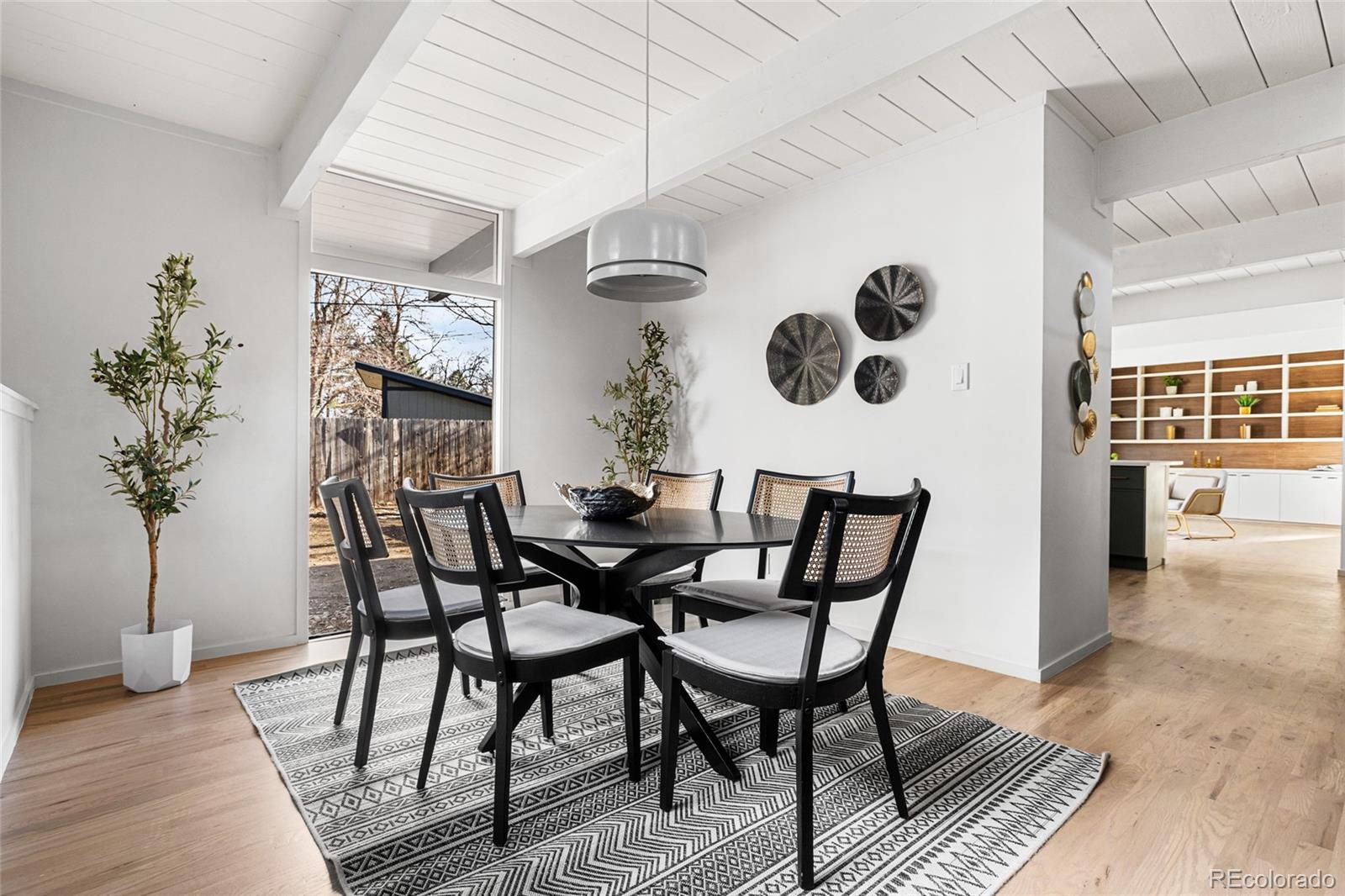 1812 South Ivanhoe Street Denver, CO 80224 - Photo 20 of 46 a view of a dining room with furniture and wooden floor