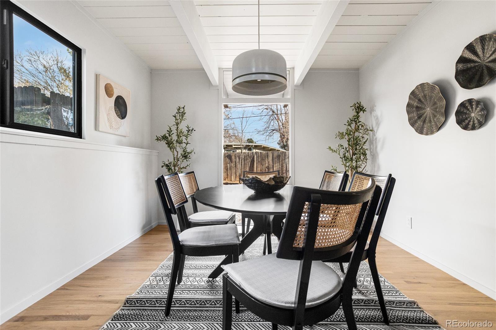 1812 South Ivanhoe Street Denver, CO 80224 - Photo 21 of 46 a dining room with furniture and window