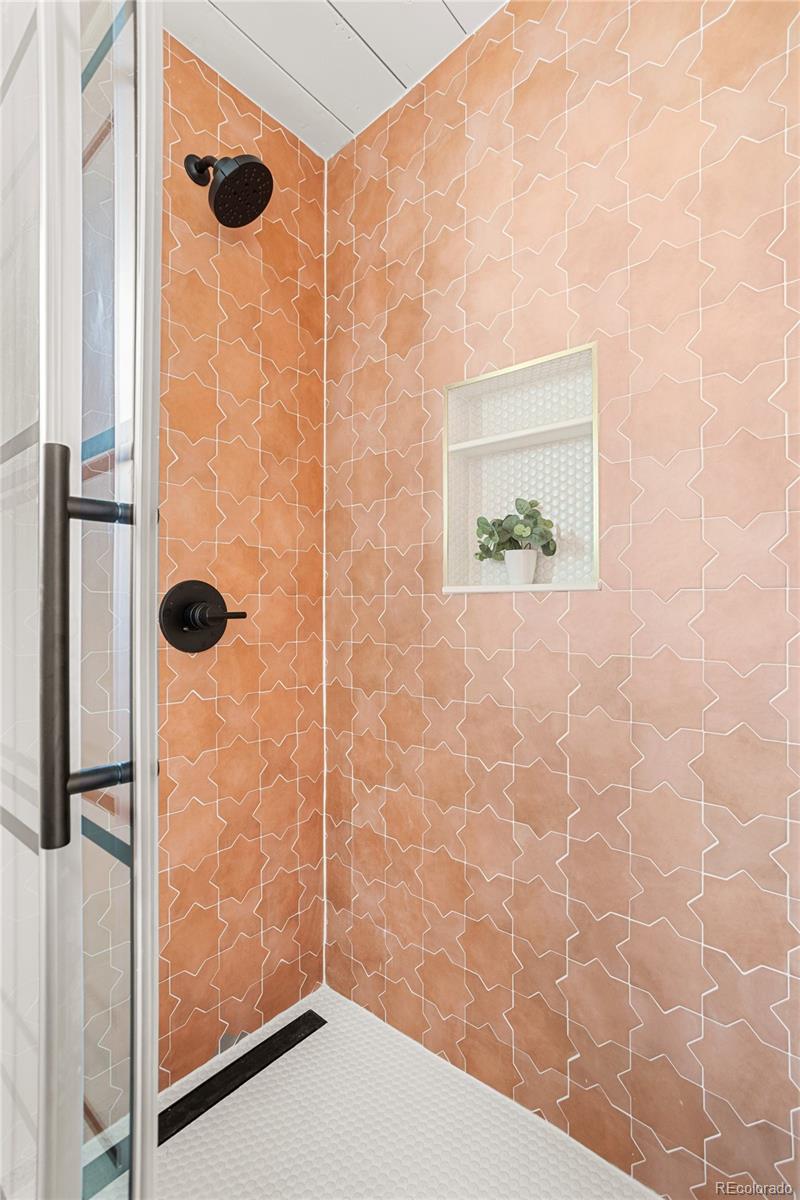 1812 South Ivanhoe Street Denver, CO 80224 - Photo 27 of 46 a bathroom with a shower