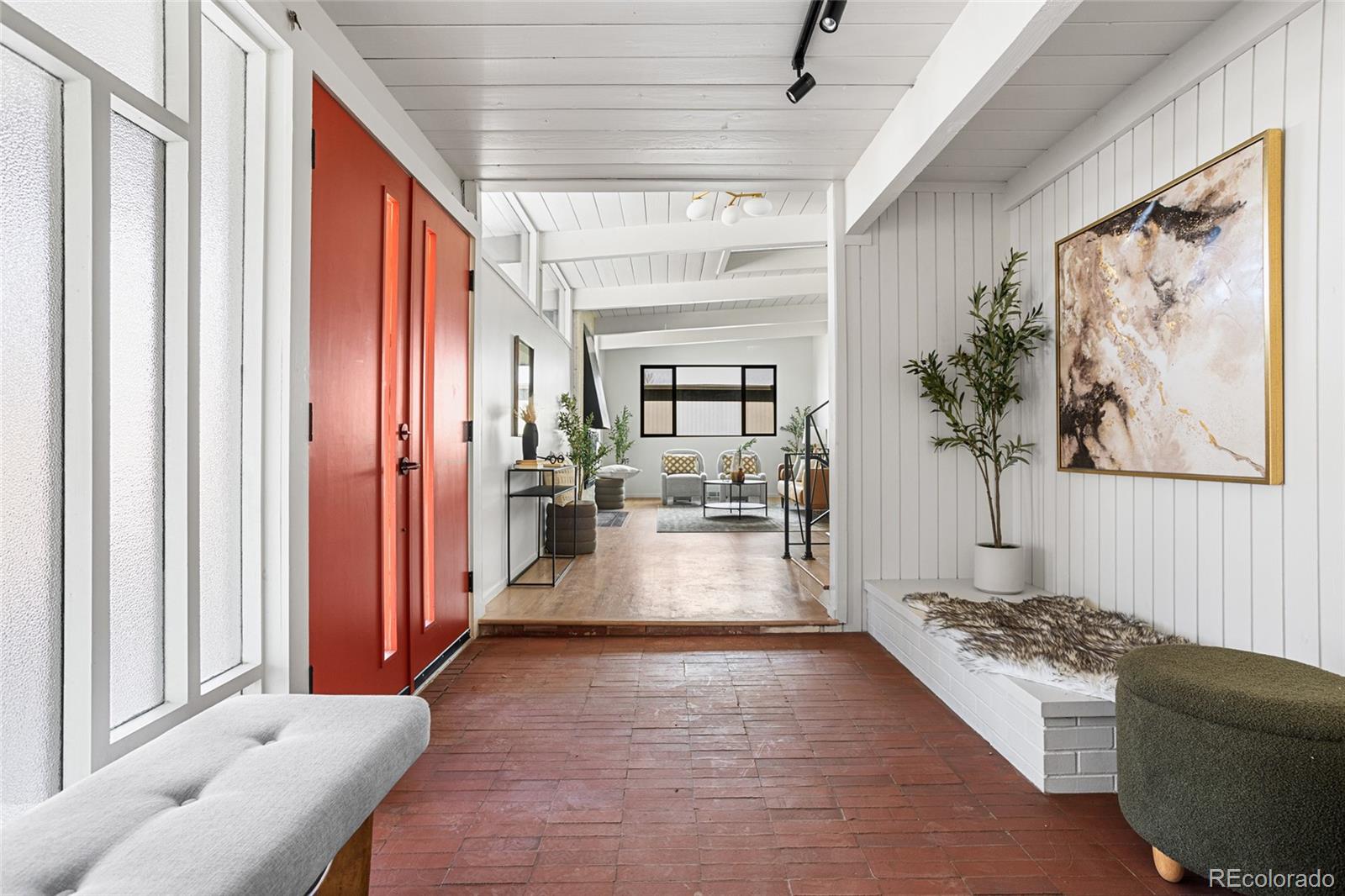 1812 South Ivanhoe Street Denver, CO 80224 - Photo 3 of 46 a living room with furniture and a large window