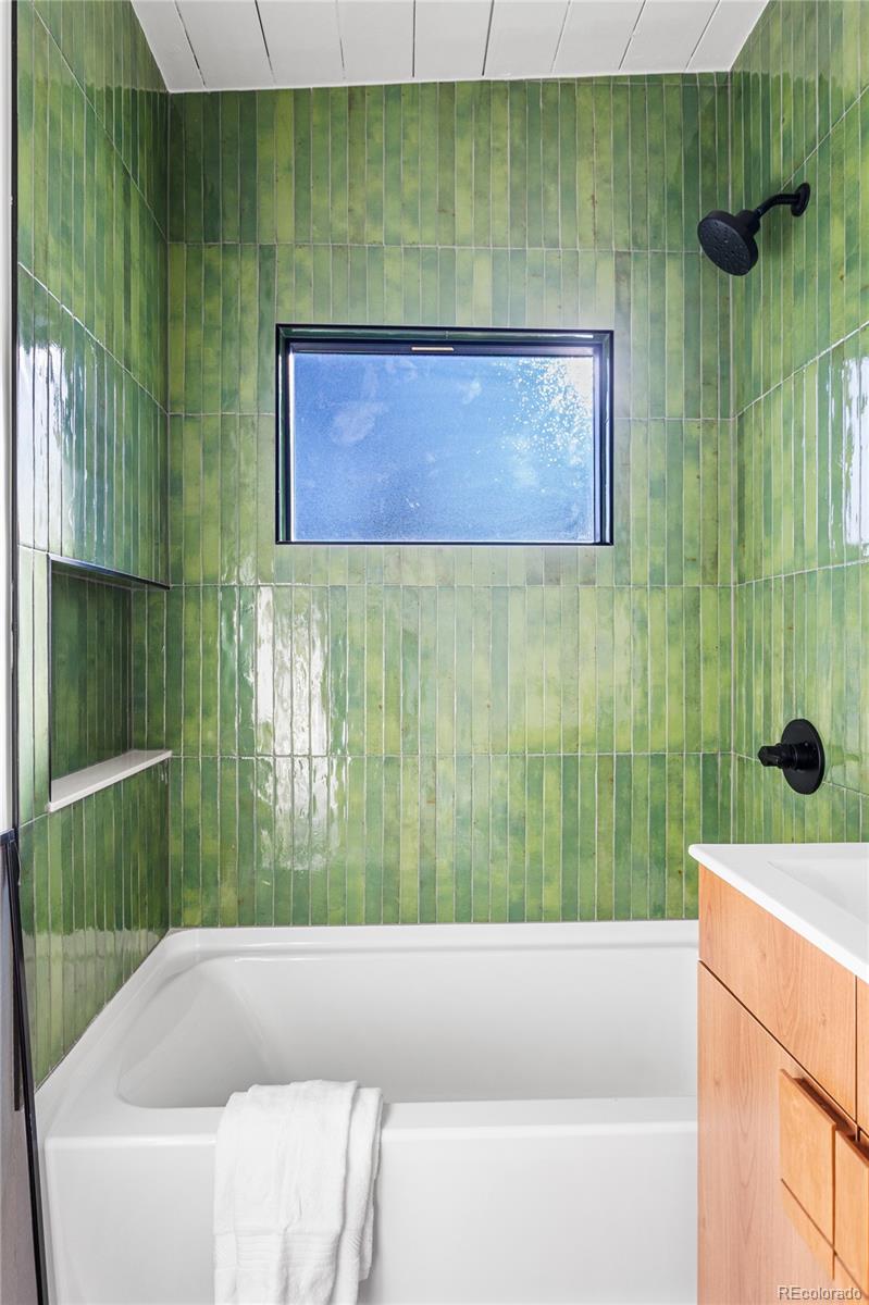 1812 South Ivanhoe Street Denver, CO 80224 - Photo 32 of 46 a view of a bathtub in a bathroom