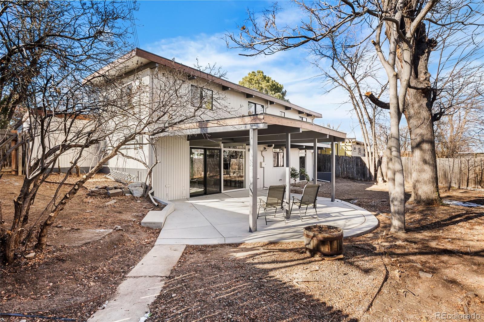 1812 South Ivanhoe Street Denver, CO 80224 - Photo 36 of 46 a view of a house with a yard and sitting area