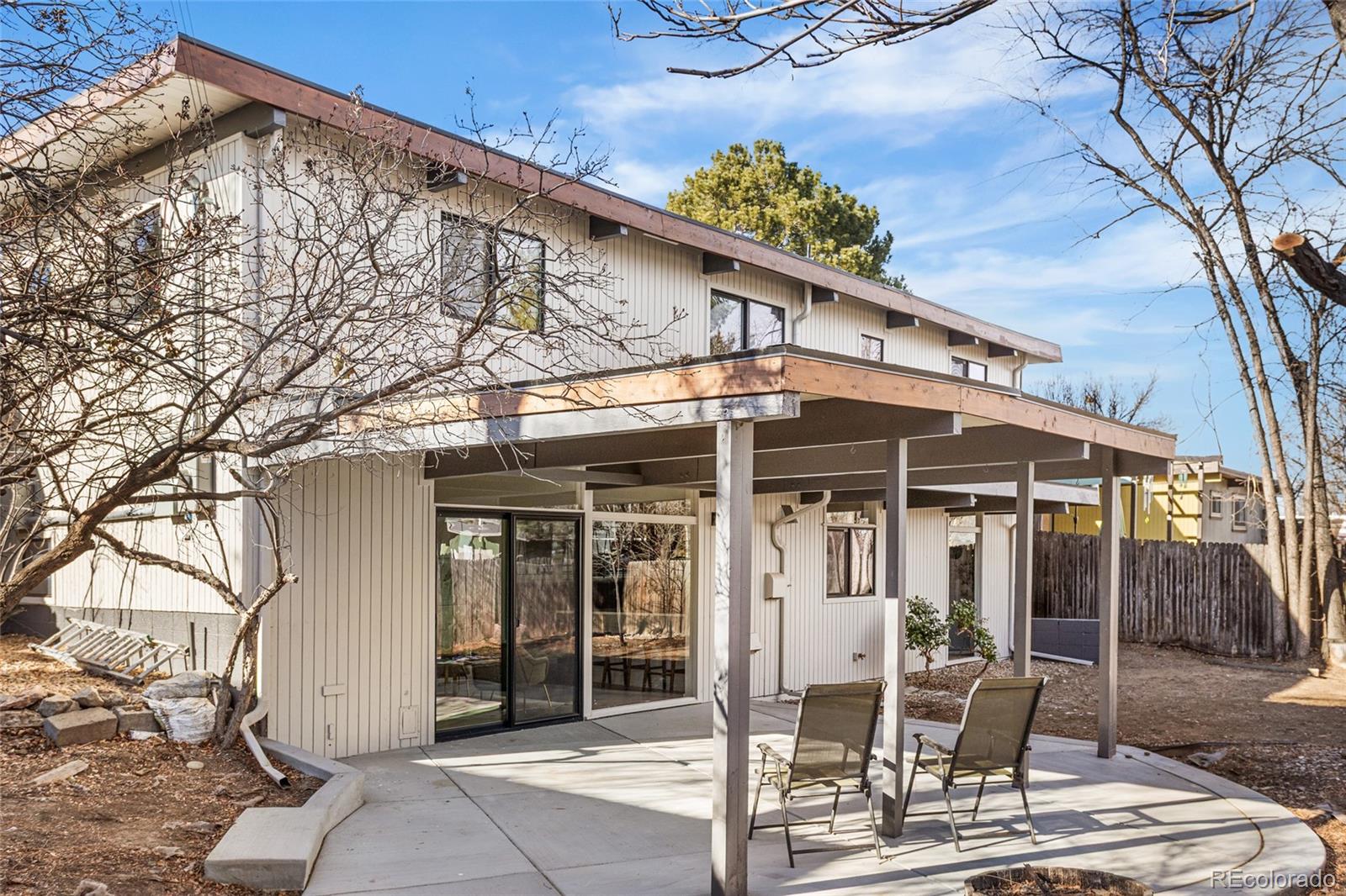 1812 South Ivanhoe Street Denver, CO 80224 - Photo 37 of 46 a front view of a house with a porch