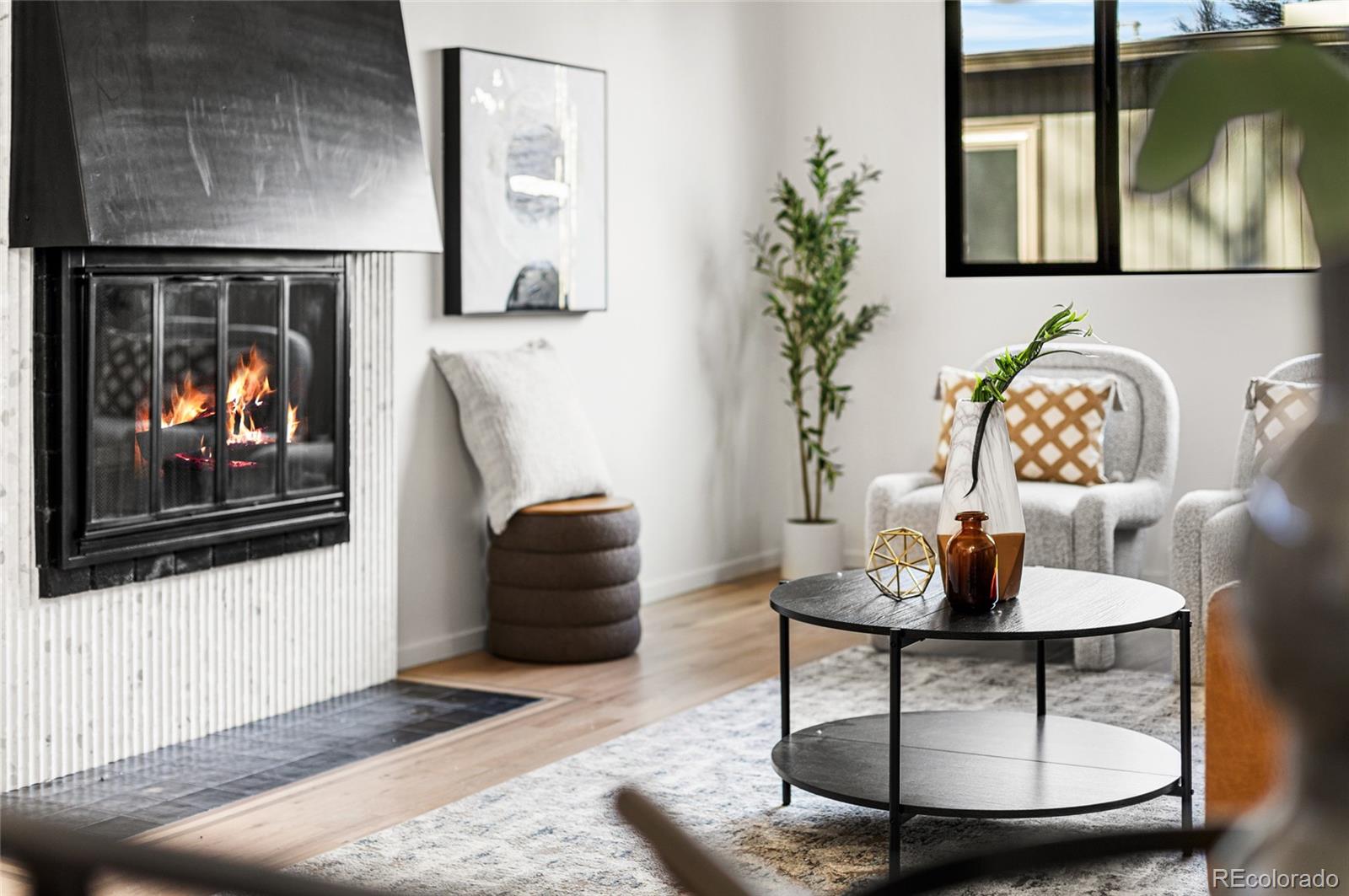 1812 South Ivanhoe Street Denver, CO 80224 - Photo 40 of 46 a living room with furniture and a fireplace