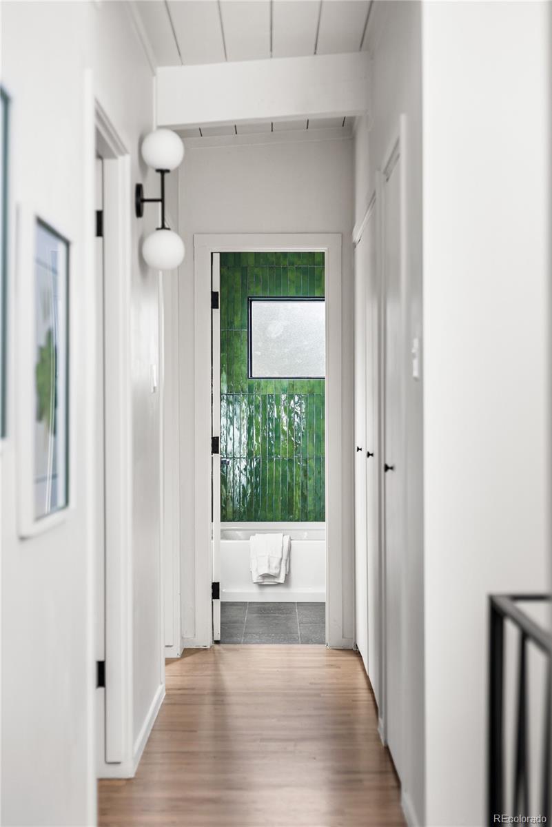 1812 South Ivanhoe Street Denver, CO 80224 - Photo 44 of 46 a view of a hallway with wooden floor windows and entryway