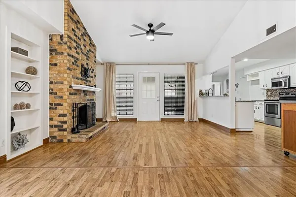 a view of a kitchen with furniture and a fireplace