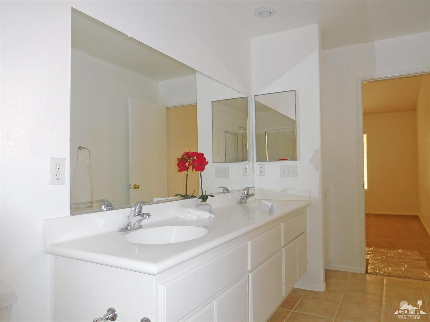 49699 Truman Way Indio, CA 92201 - Photo 12 of 19 a bathroom with a sink and a mirror