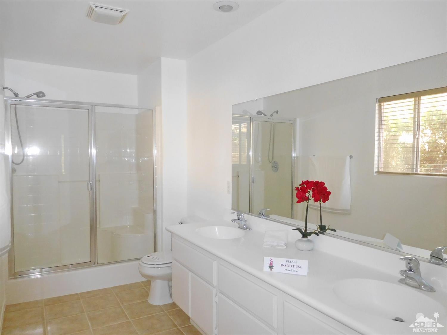 49699 Truman Way Indio, CA 92201 - Photo 13 of 19 a bathroom with a sink and a mirror