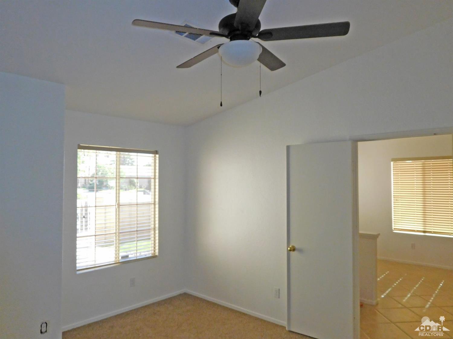 49699 Truman Way Indio, CA 92201 - Photo 14 of 19 a view of an empty room with a window