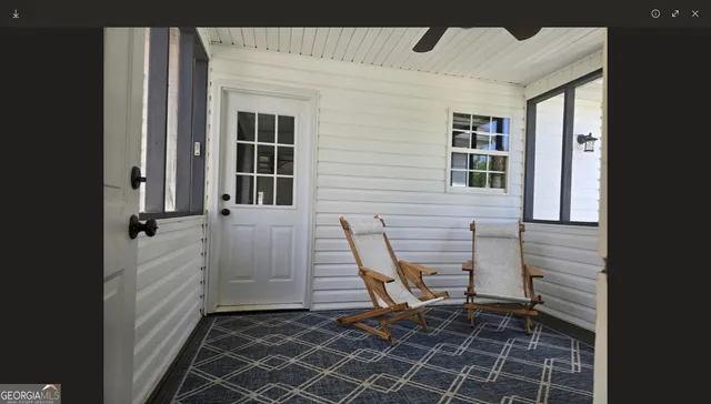 a view of a deck with a backyard