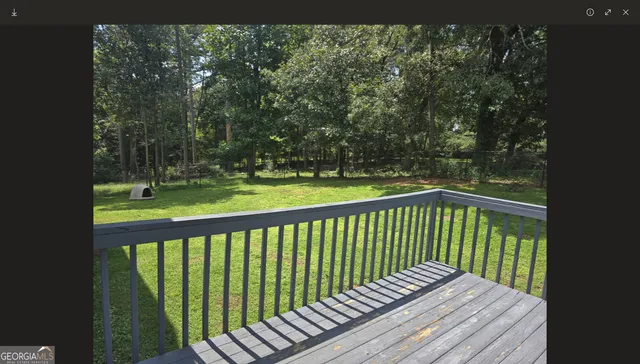 a view of balcony with wooden floor