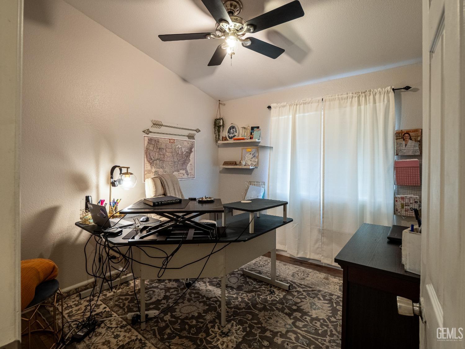 Undisclosed Address Bakersfield, CA 93312 - Photo 16 of 25 a living room with furniture and a chandelier