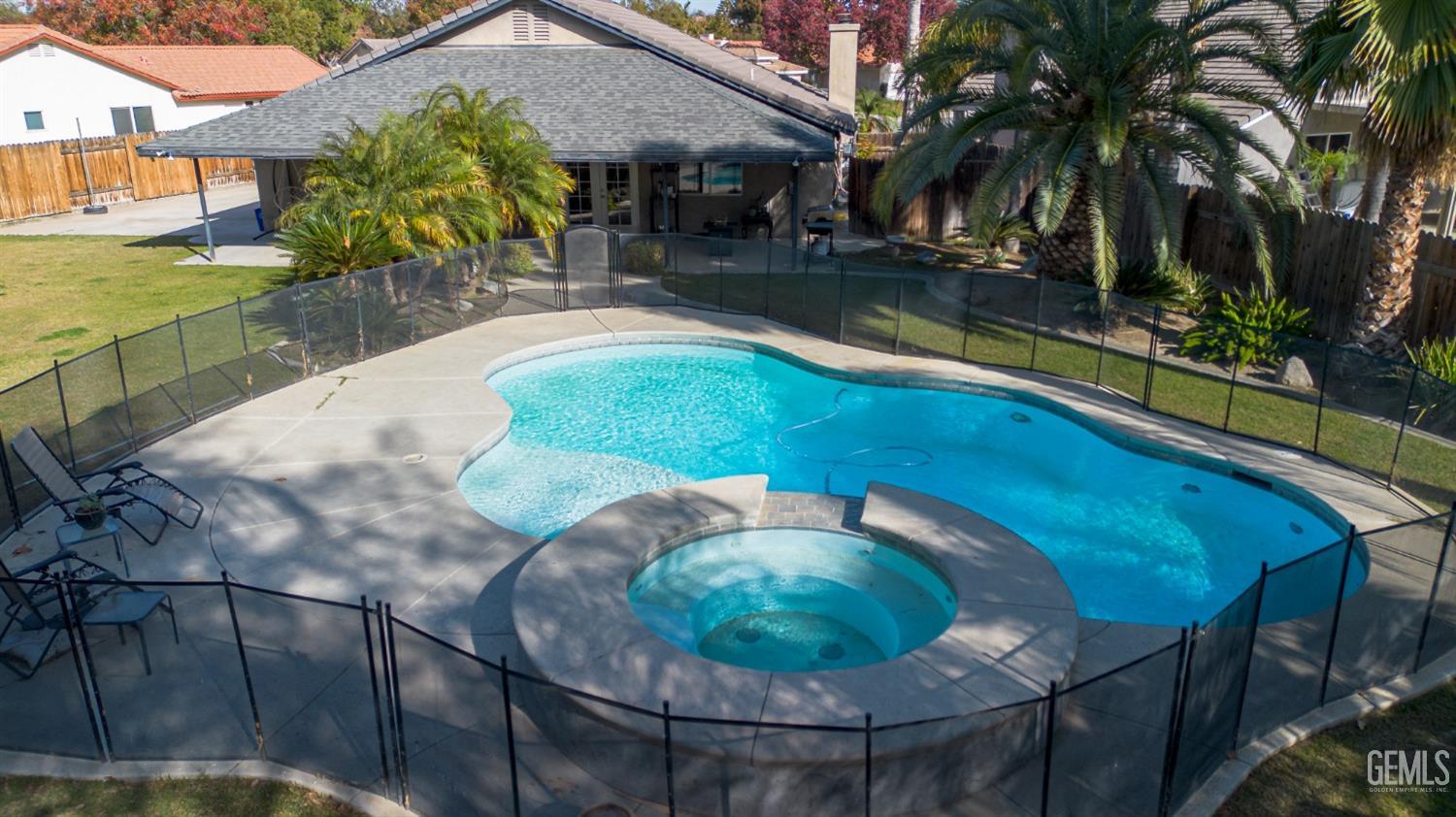 Undisclosed Address Bakersfield, CA 93312 - Photo 21 of 25 a view of a swimming pool with a patio