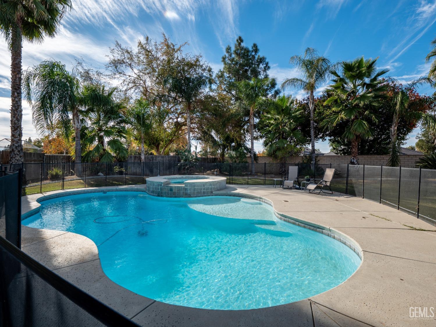 Undisclosed Address Bakersfield, CA 93312 - Photo 23 of 25 a view of a swimming pool with a sitting area